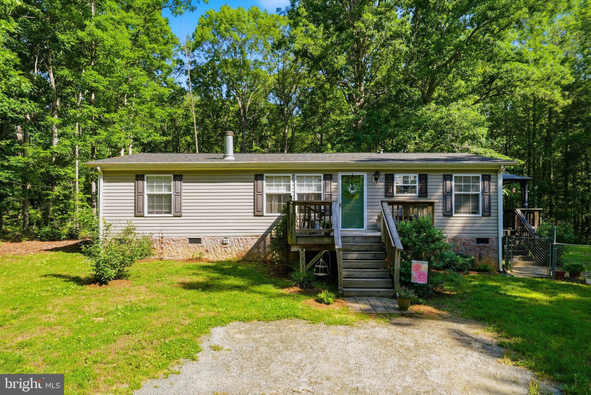 Discover the perfect blend of country charm and modern convenience in this beautifully maintained 3-bedroom, 2-bathroom ranch-style home. Nestled on an expansive 7-acre lot, this property offers an exceptional opportunity for homesteading, entertaining, or future expansion. Key features & upgrades include upgraded flooring throughout, elegant crown molding, and a cozy wood-burning fireplace perfect for chilly evenings. Peace of mind comes built-in with a new roof (2024)and a new water heater (2025). Enjoy outdoor entertaining on two decks overlooking a securely fenced backyard. The cabana on the back deck is another new addition to the property and is conveyed with the home. Bring your animals, equine or fowl, because there is a barn and tack room, making it fully prepared for your farm animals and outdoor hobbies.

Don't delay! Properties with this unique mix of acreage, infrastructure, and expansion potential rarely stay on the market long. Schedule your showing today!