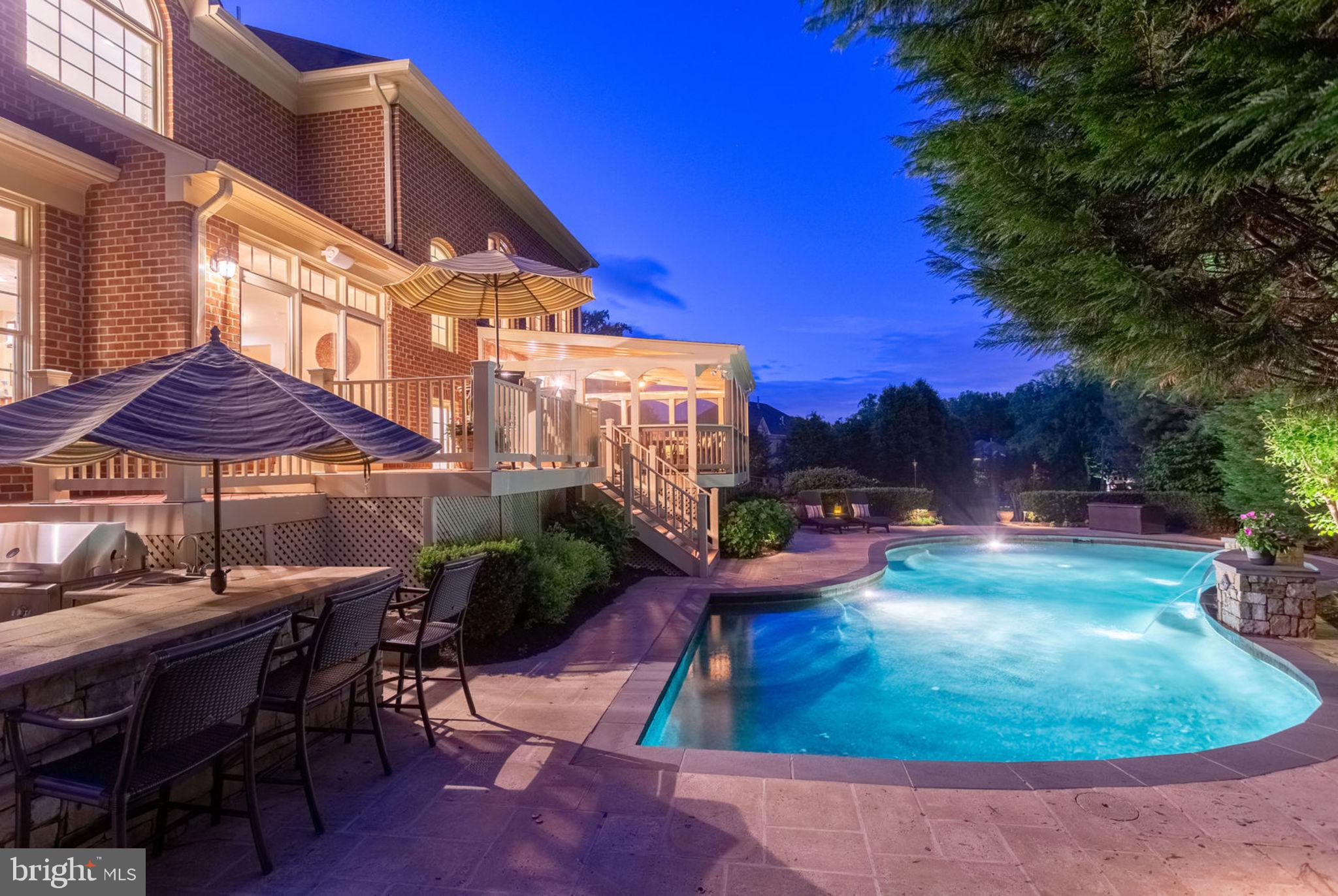 Just Listed & Open Sat & Sun 2-4PM! Elegant All Brick Colonial w/ Tranquil Resort-Style Oasis in the back yard. The interior boasts almost 9000 Sq Ft with 4 BR/ 4.5BA/3-Car Garage on a .84 Acre cul-de-sac lot.  Open Floor Plan, Light Filled Rooms, 2-Story Foyer, Great Room with Palladian windows & Gas FP.  Gourmet Kitchen w/ Granite, SS Appliances, Double Oven, Island, & Breakfast Rm.  Main level includes Study, Sunroom, Dining Rm, Living Rm & Mudroom/Laundry.  Master Suite w/ Private Sitting Rm, His/Hers WICs & Updated Master Bath w/ 3 Vanities, Shower, Soaking Tub & Commode Rm. Light Filled Basement w/ 2nd Family Room, Bonus Room Suite, Full Bath & over 1500 Unfinished Sq Ft awaiting the imagination.  The Basement Walks-up to the Generously sized Yard.  Walk out from to the Kitchen to the private Screened Porch & deck overlooking the Resort Like Patio, Salt Water Pool & Outdoor Kitchen.  Modern Updates, Neutral Tones, and a Generous Floor Plan make this a home every buyer will Enjoy!