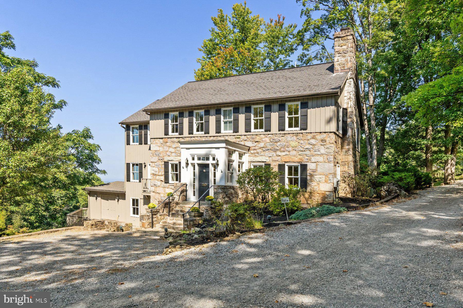 If you’ve had visions of owning a beautiful, fully restored, historic Virginia fieldstone home, with its very own winery, vineyard and tasting room, look no further. 

Welcome to this cherished property and boutique winery, with a long history of award-winning wines and priceless views of the Shenandoah Valley. Set on 6.53 scenic acres, with a beautifully manicured vineyard, the original fieldstone house was built in 1893, subsequently operating as an inn for visitors from Washington DC, who would travel by train on the Washington and Old Dominion railroad (today the W&OD trail), to enjoy the cooler summer temperatures at this higher elevation. 

In 1998, the house was meticulously restored by the current owner, incorporating modern conveniences while retaining the exquisite architectural beauty of a bygone era. Entering the house through the classic flagstone floor vestibule reveals an open plan dining room and living room, with gorgeous hardwood floors, and wonderful beamed ceilings and millwork. The bright kitchen, opening with French doors from the dining room, has granite counters with a white tiled backsplash and center island. Beyond the dining room and kitchen is the family room with a wall of windows from which to take in the beautiful Shenandoah Valley views. 

Off the hall is a cozy sitting room with access to the first-floor full bath, which also serves as a powder room. The back hall accesses the laundry room and French doors to a spacious deck. 

Upstairs on the second level is the primary bedroom, with attached bathroom and spacious private den with western facing windows taking in the sunset views. There are two further bedrooms on the second level, and a bright hall bath. 

The lower level is home to the winery with four large rooms, including barrel room with cathedral ceiling, and a large storage room for equipment, as well as a full bathroom and mechanicals. 

A short stroll to the tasting room reveals a substantial facility, with beamed cathedral ceilings, and a view-facing wall of windows, a serving bar and kitchen plus two restrooms, and two propane fireplaces. 

Extensive decks off the testing room provide significant outdoor space to enjoy the breathtaking valley views, as well as the lush, manicured vineyard below. Beneath the tasting room is a private club room with a fireplace and large additional storage and utility room. 

In addition, the property features a storage barn next to the vineyard, a small stone storage building and an adorable stone guest cottage, with an open living area, Murphy bed, kitchenette and bathroom. Set on over six west facing acres, the fine property with its picturesque vineyard – half in 20-year old vines and half with 10-year old grapevines - is now ready for its next stewards to continue an incredible legacy into the future