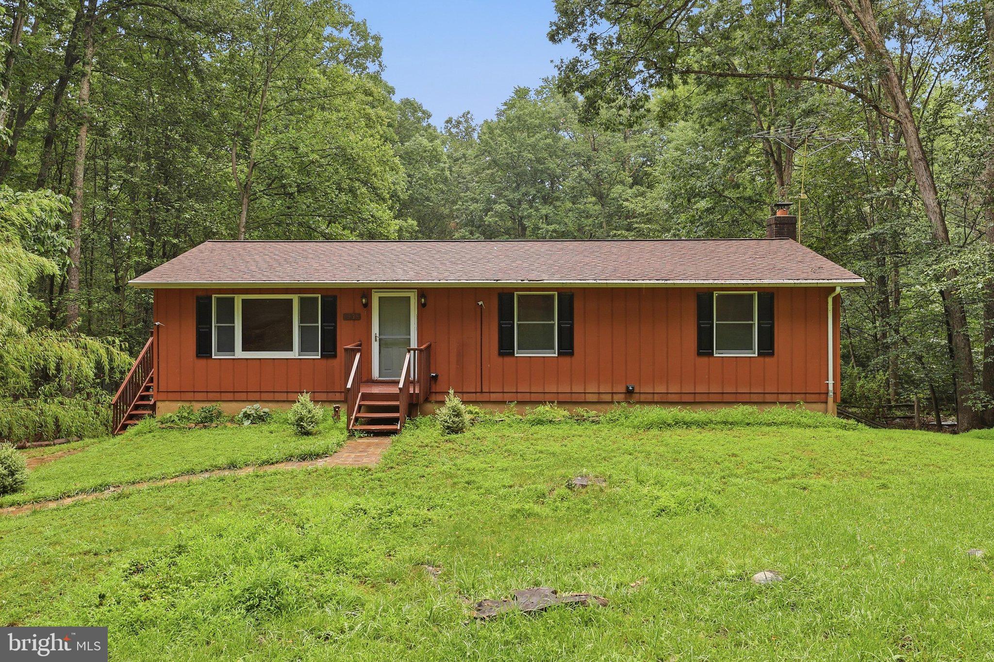 Nestled on 3.361 private wooded acres, this home offers the peace and serenity of nature while providing plenty of room to make it your own. Surrounded by mature trees and featuring a tranquil pond, established landscaping, and abundant outdoor space, this property is a rare opportunity for those seeking privacy and potential.
Several important updates have already been completed, including a new 32-gallon pressure tank (2024), well pump (2016), deck (2010), Roof (2008), and septic system pumped and inspected (2023).

Inside, this well-loved home is ready for your personal updates and vision to restore it to its full potential. The finished basement includes a spacious family room with an egress window that has been used as the primary suite, complete with a walk-in closet and a full bathroom, offering flexible living arrangements.

The property is being sold strictly AS-IS. Due to repairs or improvements that may be needed, it may not qualify for FHA financing.

Come explore everything this unique property has to offer and imagine the possibilities of making it your own.