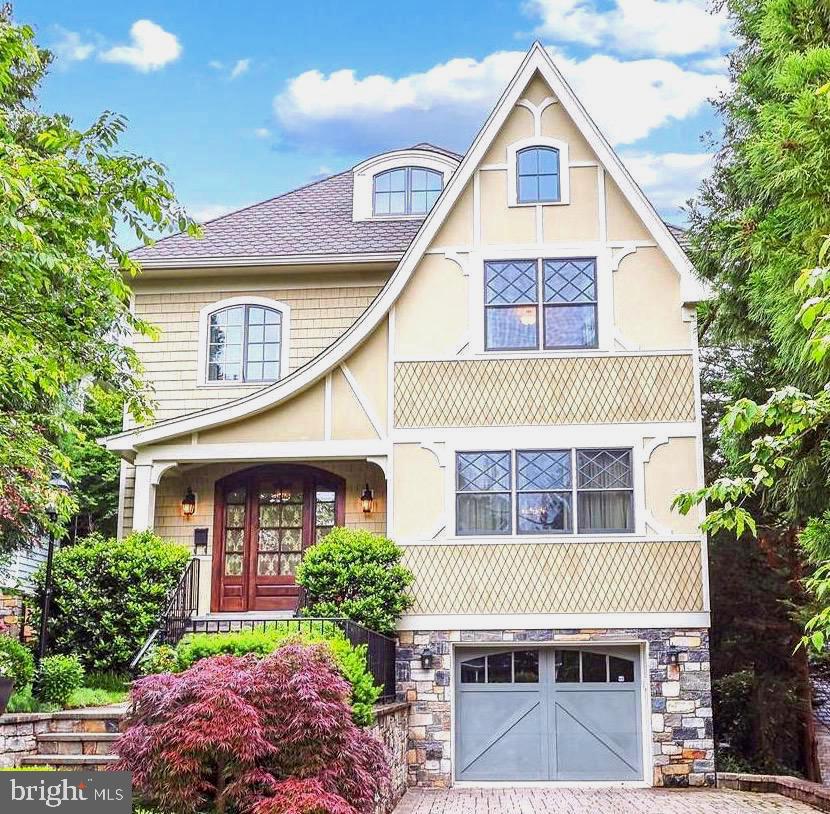 Exquisitely detailed and thoughtfully designed by Chryssa Wolfe of Hanlon Design and Build, this stunning home seamlessly blends modern luxury with timeless elegance.  The property boasts expansive, light-filled rooms that provide the perfect backdrop for gatherings of all sizes.  Impressive foyer with walk in coat closet, library with built-ins, living room with gas fireplace and dining room sized for both large scale dinner parties and intimate gatherings.

The chef’s kitchen boasts custom cabinetry, top-of-the-line appliances, a generous island with ample seating, two pantries and abundant counter space to make meal preparation both functional and enjoyable.  Amazing family room with coffered ceiling, cozy fireplace and french doors overlooking your private poolside oasis.

Custom staircase with wrought iron/wood rails takes you to the second level.  It features four bedrooms, all with en-suite bathrooms and large closets including the sweeping primary suite with spa like bath and custom fitted dressing room.  Separate laundry room is also conveniently located on this level. 

The third level offers a spacious second family room with a tray ceiling, 5th bedroom and full bath.  There is a large exercise room that can also function as an additional bedroom plus plenty of storage.

The finished lower level features a light filled recreation room with gas fireplace, game room, wet bar and walk out to the side yard.  This level also boasts a guest half bath, bedroom with en-suite full bath, mud room and fully equipped catering kitchen.  The versatility of the lower level makes it perfect for entertaining or an in-law/au pair suite.  This level connects to the oversized garage and ample storage.

The exterior of this magnificent residence is equally as impressive as the interior featuring an in-ground heated pool with automatic cover, flagstone decking, and professionally landscaped grounds.  Private wooded setting perfect for year round relaxation or hosting poolside events.  This home offers the ultimate combination of comfort, style, and convenience, all within a prime location in the nation’s capital.