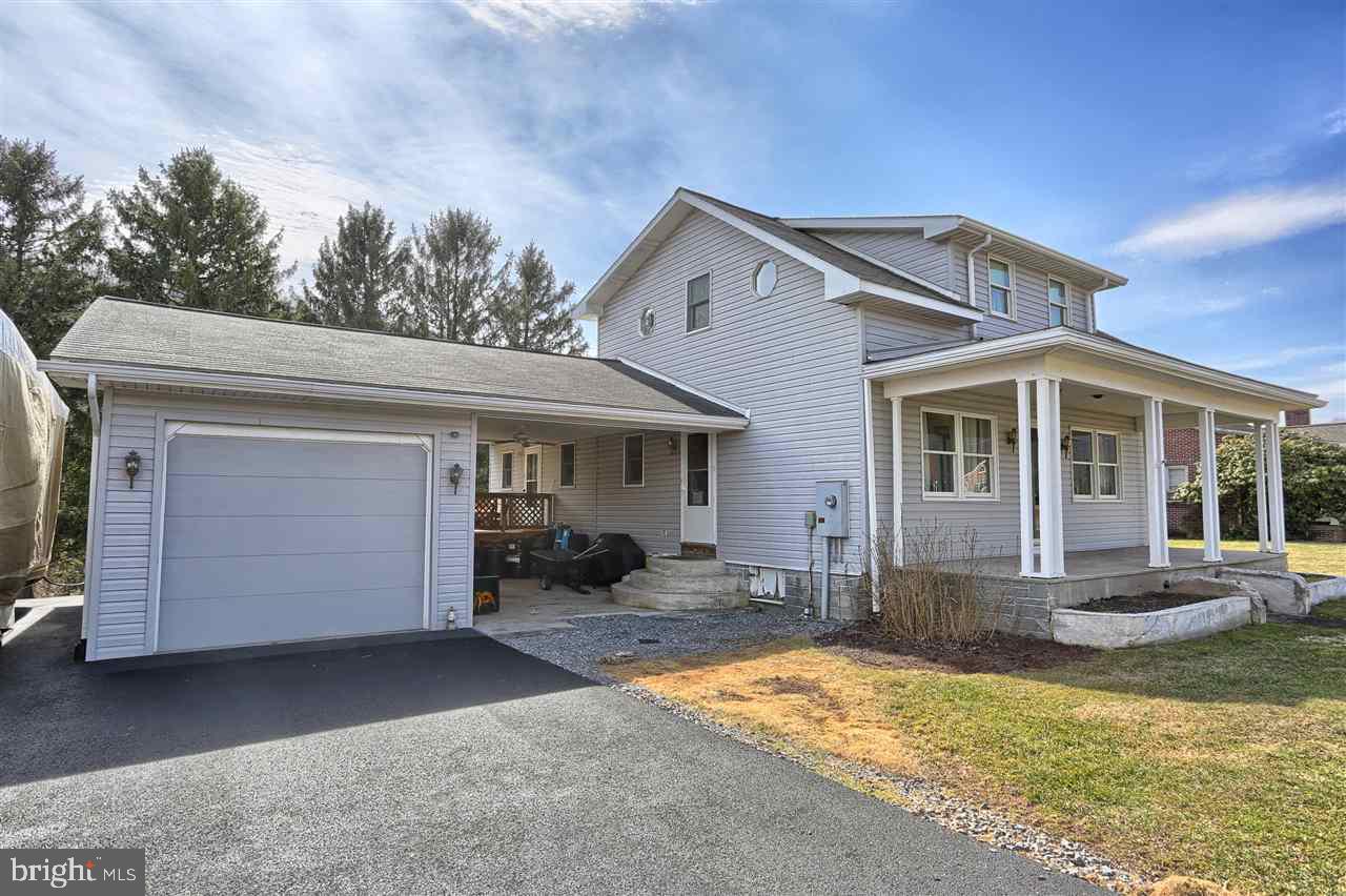 Move in ready home on 31+ acres with more upgrades than you can shake a stick at.  Enjoy the croaking frogs, the chirping of the crickets and the gobble of the wild turkeys while sipping coffee from your deck, if it's chilly get cozy and warm by the gas fireplace. Cast a line and catch dinner as Raccoon Creek runs through the yard or enjoy hunting right in your wooded back yard.  Home exudes "Pride of Ownership" everywhere you meander.