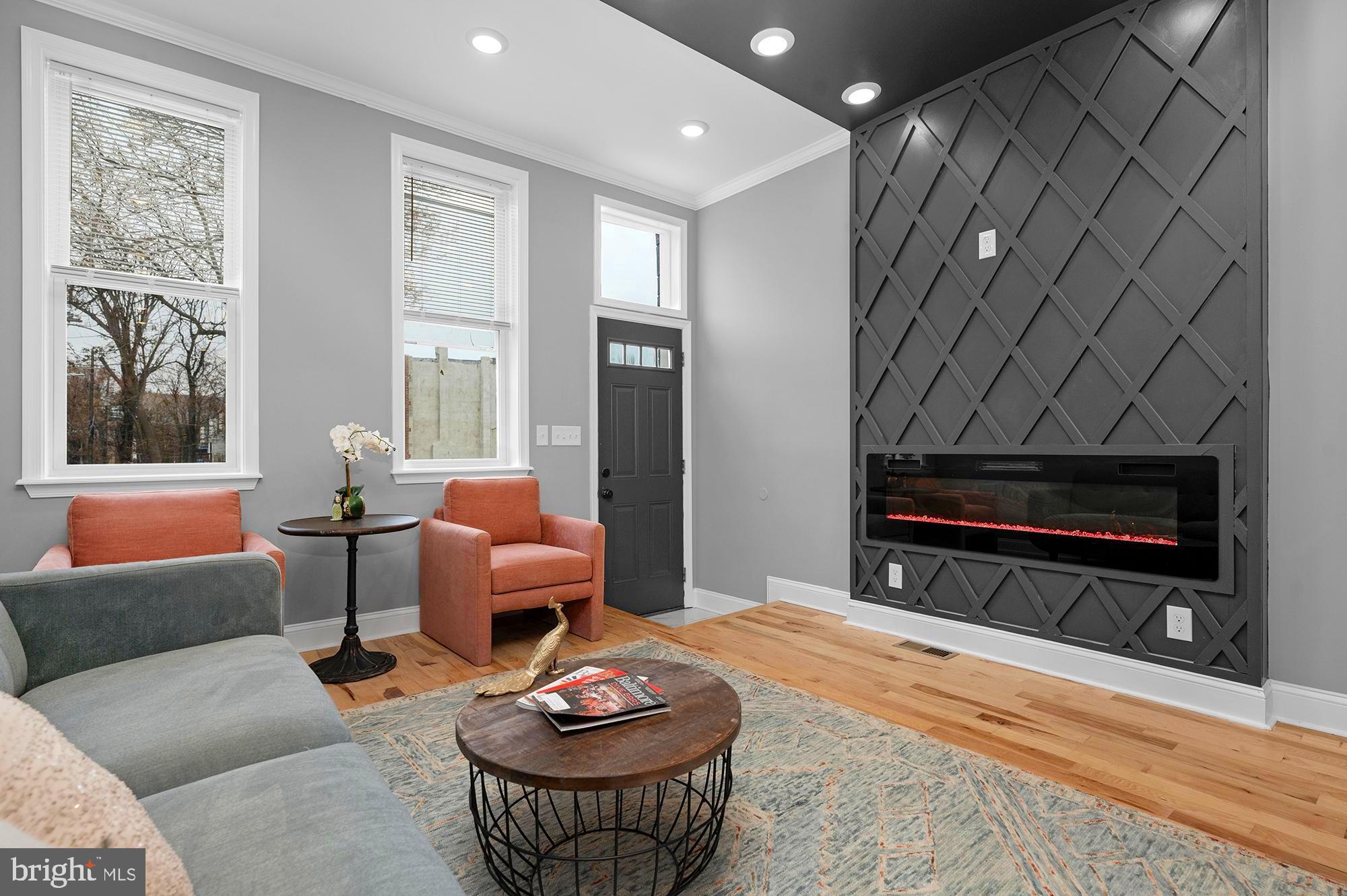 Welcome to 1908 E Lanvale – a contemporary, state-of-the-art renovation in a thriving neighborhood. Designed with impeccable attention to detail, this home seamlessly blends luxury and functionality. Enter the main level to find an airy, open floor plan with custom tray ceilings, a sleek modern fireplace, and exquisite hardwood floors. The gourmet kitchen serves as the heart of the space, featuring Shaker cabinetry,  stone countertops and stainless appliances. 

The upper level hosts three  bedrooms with large closets and spa-inspired bathrooms, creating a serene retreat. The fully finished, walk-out lower level includes a private guest area with its own full bathroom, and a den perfect for remote work or extra living space. Outdoors, a fenced backyard offers privacy and is ideal for entertaining. This home also boasts a new HVAC system, all-new electrical, plumbing, framing, and roofing—every component thoughtfully upgraded. Experience modern city living at its finest. Come, see, and make 1908 E Lanvale your new home