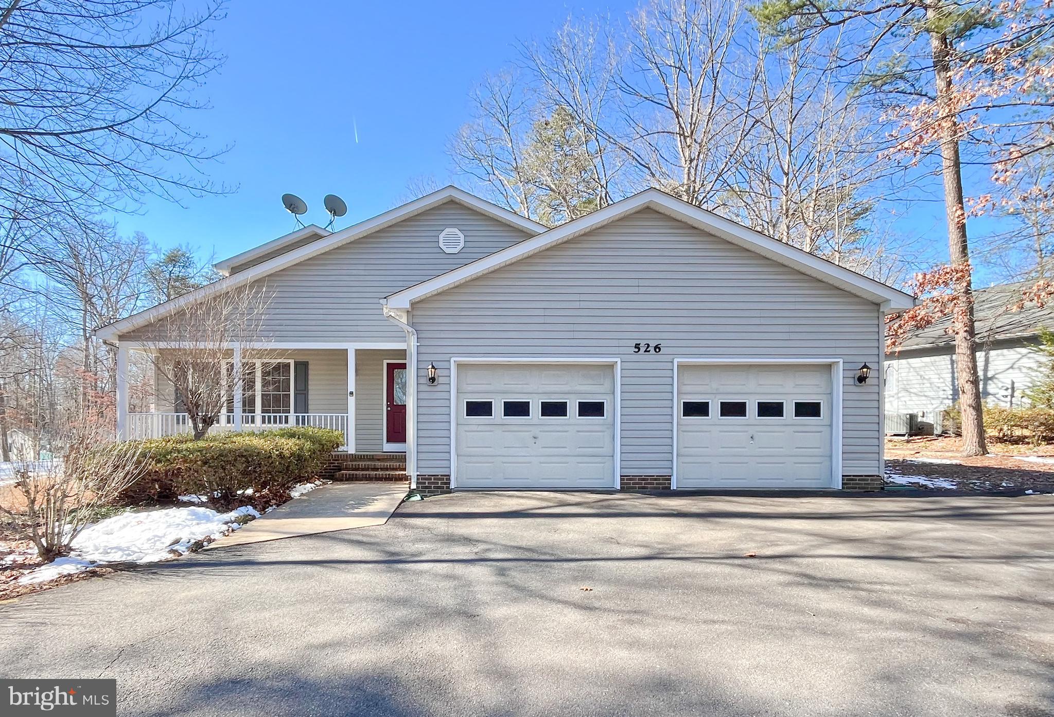 Welcome to 526 Mt Pleasant Dr, Locust Grove, VA 22508! This charming two-level ranch-style home offers the perfect blend of modern comfort and timeless appeal in the sought-after Lake of the Woods community. A welcoming covered front porch sets the tone for relaxation before you step inside to be greeted by gleaming solid hardwood floors that flow seamlessly throughout the main level. Designed for effortless main-level living, this home features a primary bedroom with an en-suite bath conveniently located on the main floor, creating a perfect retreat. Additionally, the main-floor living room offers stunning views of the golf course, enhancing the home's serene and picturesque ambiance. The primary bedroom also boasts an exceptionally large walk-in closet, providing ample storage space. The living area features soaring vaulted ceilings, enhancing the sense of openness, while the cozy fireplace adds warmth and charm. The large kitchen boasts quartz countertops, white cabinetry, and stainless steel appliances, while a beautiful bay window in the breakfast room adds a modern touch. Its main-level location alongside the laundry room further enhances convenience. The living and kitchen areas flow together seamlessly, creating an open and inviting atmosphere that is perfect for both everyday living and entertaining. Upstairs, two sunlit bedrooms and a full bath provide comfortable accommodations for family and guests. Whether you are enjoying the natural light streaming through the windows or the convenience of a thoughtfully designed layout, this home truly embodies a balance of style, comfort, and functionality. All of this is complemented by a tranquil setting backing the lush 16th hole on the community’s USGA Golf Course. Lake of the Woods provides an abundance of amenities, including two lakes for swimming and boating, community pools, basketball and tennis courts, an equestrian center, a clubhouse, a fitness center, and miles of scenic walking paths. This move-in-ready home not only offers modern comfort and thoughtful design but also boasts breathtaking golf course views and premium community amenities. Do not miss the opportunity to experience luxurious living in one of Northern Virginia’s most desirable communities! **** New Update 3/15/2025 - This estate sale property is being sold strictly as-is. Recent upgrades include brand new architectural shingles (March 2025), a new garage frame, and a garage opener (March 2025). The home has been freshly painted and is in excellent condition.****