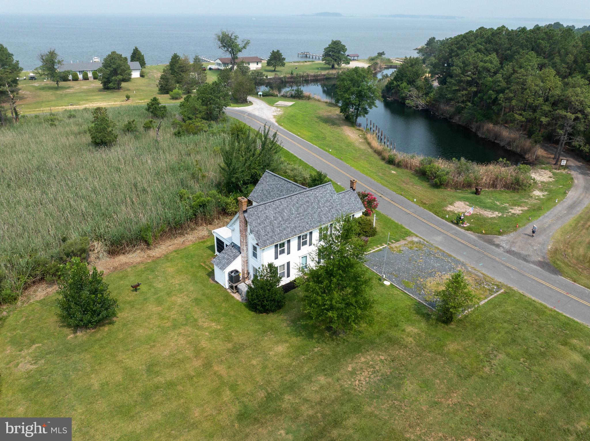 Welcome to this charming 4-bedroom, 2-bathroom home nestled in a sought-after water-privileged community with stunning water views. Residents enjoy exclusive access to a private beach, waterfront gazebo, and all the benefits of coastal living.

This well-maintained home offers an open and inviting interior featuring beautiful cherry cabinetry, stainless steel appliances, and granite countertops in the kitchen. A brand-new HVAC system provides year-round comfort and peace of mind.

Outside, you'll find a spacious yard, a storage shed for all your outdoor gear, and a dedicated crab deck—perfect for enjoying the waterfront lifestyle.

With a proven short-term rental history and excellent income potential, this property is an outstanding opportunity as a primary residence, vacation home, or investment property. Don't miss your chance to own a home that combines comfort, convenience, and the best of waterfront community living.