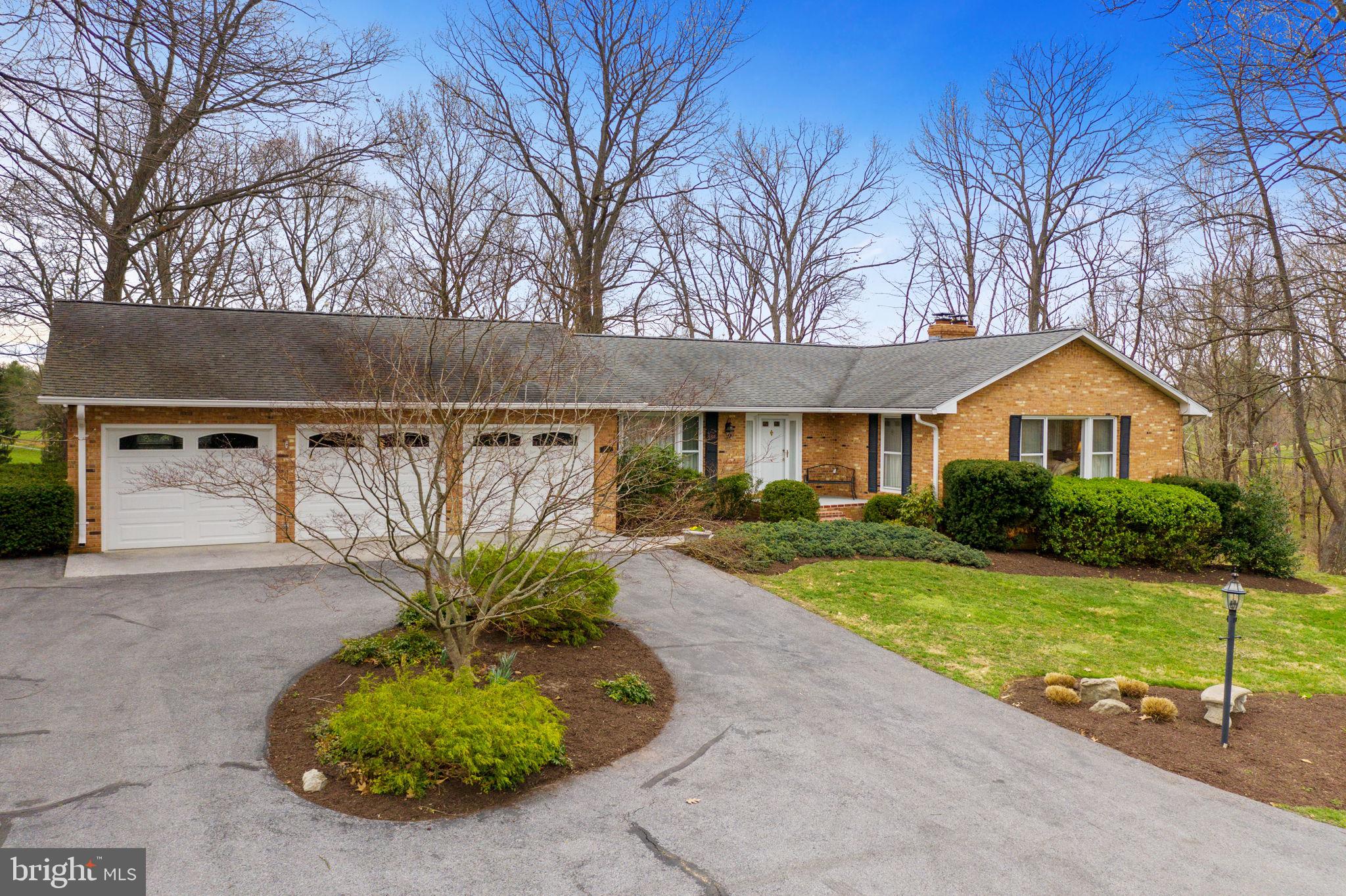 One Level Living in this beautiful brick home overlooking the Shenandoah Valley & Bowling Green golf courses - 63 holes of golf are right outside your door.  The sun-filled living room is a perfect place to  great your guests or enjoy a good book.   Main level family room with wood-burning fireplace is filled with natural light.  Large eat-in kitchen featuring granite counters with doors to multi-level deck off the dining area.  Wonderful sun room for morning coffee, rainy day games or just relaxation.  A tremendous sized lower level rec room features area for large pool table, bar area and a dance floor.  Need an at home office?  Be sure to check out the lower level space with built-ins and plenty of space for 2 or more desks.  Be sure to check out the property video for drone footage and the iGuide 3D Tour for a true walk-through experience.