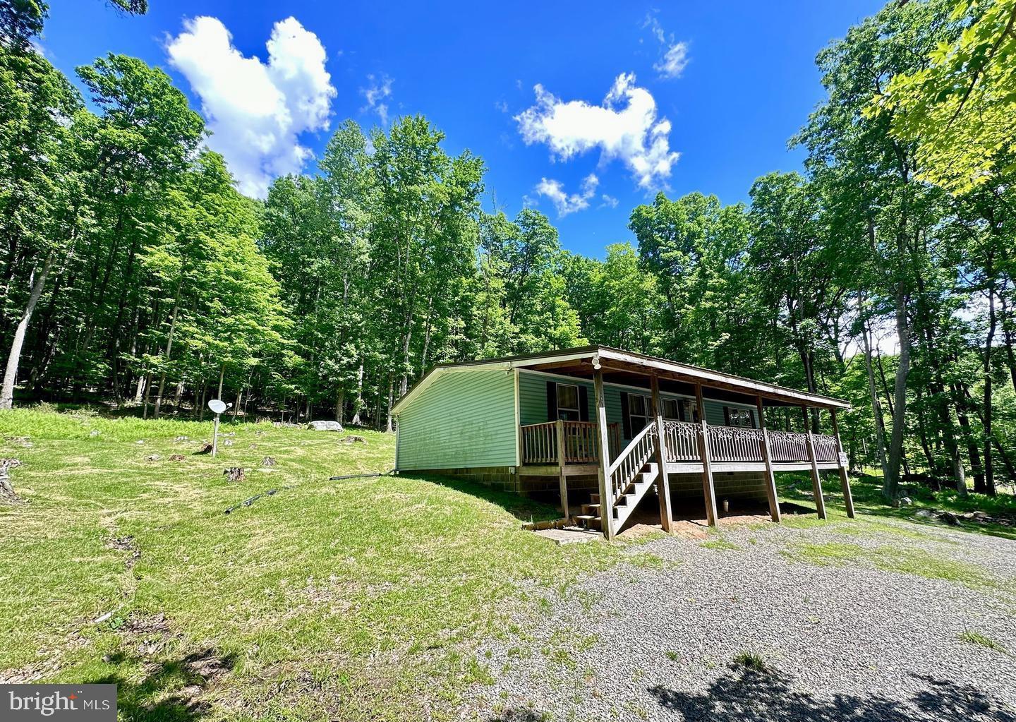 Make it your own! This 2-acre parcel comes with two additional parcels of 17.96 and 24.23 acres for a total of 42.19 acres. The 2-acre parcel is improved by a fully furnished (26’X42’), 3-bedroom, 2-bathroom Ranch style dwelling and a large parking area. The interior offers a spacious living room, and an eat-in kitchen with all appliances, furniture and window AC units. The land is un-zoned forest that borders over 2000 acres of state forest. The 42.19 acres is fully wooded with mature mixed hardwoods ready for harvest and market; the timber alone has an estimated value of $110K to $125K alone. The property overlooks the Youghiogheny River Valley and is 5.3 miles from town center McHenry and Deep Creek Lake.