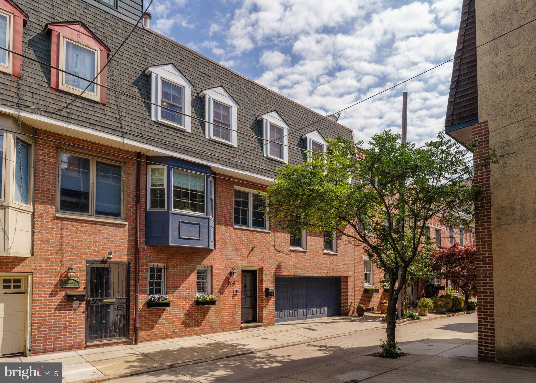 Beautifully appointed home in Queen Village's coveted Meredith catchment. This thoughtfully designed 3 bedroom, 2/2 bath triple-wide offers exceptional living with a 2-car garage and expansive private garden. The entry level features a flexible first floor space with custom cabinetry and direct access to the garden, first floor powder room and attached 2-car garage. 

The heart of the home showcases a stunning, light-filled kitchen appointed with stainless steel appliances, 5-burner duo-flex oven, farmhouse sink, and built-in wine refrigerator. The adjacent bay window dining nook with custom banquette seating creates an intimate breakfast spot. The second floor offers a separate dining room perfect for formal entertaining, while the gracious living room hosts a wood burning fireplace. The master suite boasts an en-suite bath with a convenient laundry nook and walk-in closet. Two nicely sized guest rooms and an updated guest bath offer comfortable accommodations for guests. 

Situated on one of Queen Village's most charming blocks, this exceptional property presents a rare opportunity for those seeking both form and functionality in Philadelphia's most desirable neighborhood.