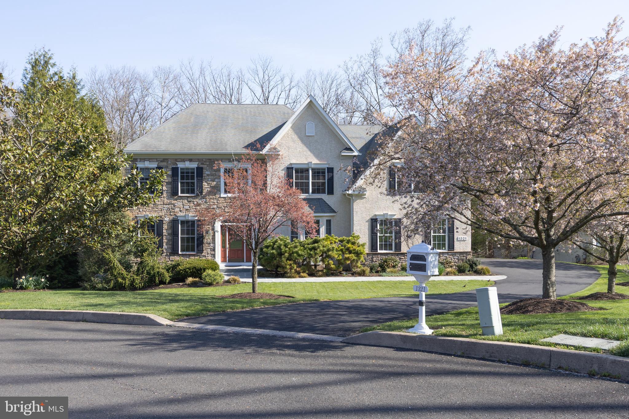 Welcome to 1321 Meadowbrook Ct , an absolutely stunning 4-bedroom, 5½-bath home, masterfully crafted by renowned builder Phil Gianni. Nestled on a quiet, private cul-de-sac in the prestigious Meadowbrook community, this exceptional residence exudes timeless elegance and showcases over $600,000 in custom upgrades. From the moment you arrive, the professionally designed, pristine landscaping creates outstanding curb appeal. A charming flagstone walkway leads to the grand two-story foyer, featuring gleaming hardwood floors, elegant crown molding, and a graceful turned staircase. The main level offers an ideal blend of grandeur and comfort. The breathtaking two-story great room is filled with natural light and features hardwood floors, a gas fireplace, custom built-ins, recessed lighting, and a convenient rear staircase. The expansive gourmet kitchen is truly the heart of the home, complete with granite countertops, tile backsplash, a large island with seating and pendant lighting, and top-of-the-line Sub-Zero and Wolf appliances, including a 6-burner gas cooktop with three ovens. Additional highlights include a built-in refrigerator, walk-in pantry, butler’s pantry with sink and wine fridge, and a sunny breakfast area with a gas fireplace and bay window. Two doors provide access to the wraparound composite deck overlooking a serene, wooded backdrop—perfect for relaxing or entertaining. Entertain with ease in the formal dining room, enhanced by a stunning custom tray ceiling and detailed wainscoting. A private office features floor-to-ceiling built-ins, while a versatile bonus room with French doors and deck access adds even more flexible living space. A beautifully updated powder room and a well-appointed mudroom with sink and custom storage complete the first floor. Upstairs, an open hallway leads to the luxurious primary suite, which includes crown molding, a tray ceiling, two walk-in closets, and a sitting area with custom built-ins. The spa-like en-suite bath offers a double vanity, jetted tub, large stall shower with seating, and a private water closet. Three additional generously sized bedrooms each feature custom closets and their own updated en-suite bathrooms.   The fully finished walk-out lower level provides incredible additional living space, including extensive built-ins, a large storage room, a refreshment area with sink and refrigerator, a comfortable living area, a full bath, and sliding glass doors leading to a covered patio. Additional highlights include a newly resurfaced driveway, whole-house generator, tankless hot water system, second-floor laundry, newer hardwood flooring, fresh paint throughout, security system, surround sound, and a 3-car side-entry garage. Ideally located near shopping, dining, train stations, and scenic walking and biking trails, this remarkable home offers luxury living at its finest. Schedule your showing today!
Please note: There is a non-formal agreement among the five homes on the cul-de-sac for an annual contribution of approximately $1,126 per home toward common lawn care and lighting.
