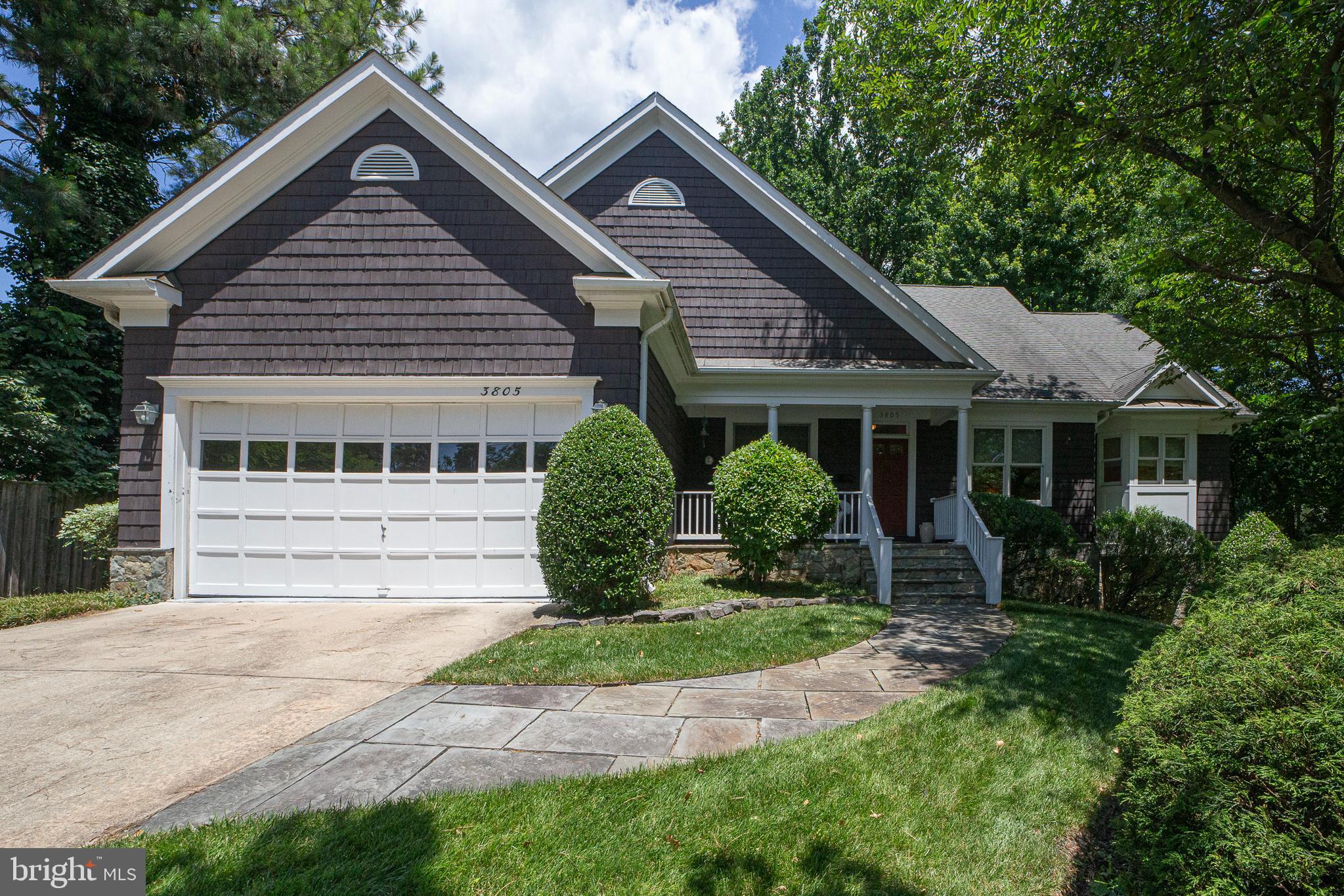 This stunning custom built home offers the best of one level living. Built by Kevin Doyle in 1999, it has style and space in all of the right places. These public spaces lend themselves to easy living as well as entertaining, It is so hard to find one level living where there is enough  entertaining and living space, without a lot of bedrooms. This one fits that bill. The family room with its vaulted ceiling and wall of windows lets the outside in and opens to the breakfast area and kitchen.  The kitchen has ample counter space and cabinetry.  The breakfast area opens to the rear deck, a perfect spot to enjoy your morning coffee.  Two bedrooms on the entry level, including a primary suite with a tray ceiling that looks out at the woods.  A spacious en-suite bath with two vanities and a separate tub and shower and two walk in closets completes the primary suite.  The second bath on the main level also features an en-suite bath.  The laundry/mudroom area leads out to the two car garage.  The lower level features a bedroom, full bath and large room with out of ground windows and a separate level entrance; perfect for a home office, potential in-law suite, care giver living or a play area.  There is even a slate walkway from the curb to the lower level entrance.  With a deck looking out onto the woods, the setting is serene.  The public library, Chevy Chase Lake Town Center w/shopping, restaurants the future Purple Line station, downtown Bethesda, Metro, and access to the Beltway, Rock Creek Parkway, East West Highway are all close by.