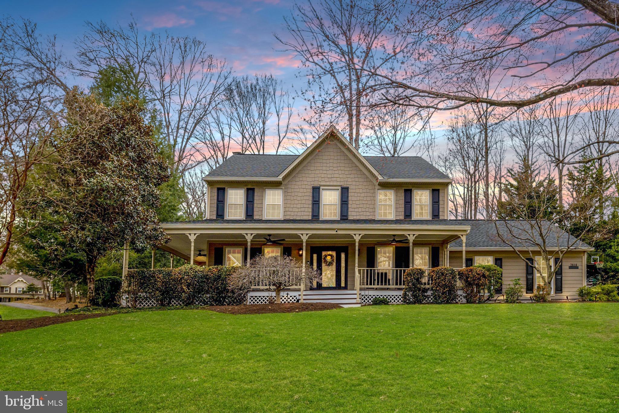 Nestled on a picturesque 1.05-acre homesite in one of Oakton’s most sought-after neighborhoods, this home is a rare offering that seamlessly blends timeless Colonial charm with sophisticated modern luxury. A welcoming wrap-around porch and impeccable curb appeal set the tone for the exceptional craftsmanship and thoughtful renovations found throughout this beautifully reimagined home.


Inside, a light-filled interior unfolds with refined finishes, rich moldings, and an elegant yet comfortable atmosphere designed for both everyday living and unforgettable gatherings. The heart of the home is the new Executive Gourmet Kitchen, a true showpiece for culinary enthusiasts. Custom oak cabinetry, Cambria quartz countertops carried up the backsplash, and a statement quartz island with thick mitered edges create a striking and functional workspace. Premium KitchenAid and ZLINE appliances, including a 48-inch 8-burner gas range with custom wood chef’s hood with powerful TradeWinds 1200 CFM ventilation system and pot filler, make entertaining effortless. A Kohler Neoroc farmhouse sink and under-sink water filtration system add both beauty and practicality.


The kitchen flows effortlessly into an expansive extended family room, enhanced by a 600SQFT addition featuring dramatic floor-to-ceiling windows that frame serene backyard views and flood the space with natural light. A beautifully upgraded stone fireplace with rustic wood mantel and accent lighting anchors the room, creating a warm and inviting gathering place. The formal dining room offers the perfect backdrop for hosting elegant dinners, while the thoughtfully designed mudroom with custom built-ins and LG high-capacity washer and dryer keeps everyday life organized.


Upstairs, the luxurious primary suite serves as a private retreat, highlighted by a spa-inspired bath featuring a rain showerhead, designer stone flooring, gold accents, and custom maple cabinetry. Additional bedrooms are generously sized and beautifully appointed, while every bathroom throughout the home has been meticulously renovated with designer lighting, new cabinetry, and elegant stone finishes.


Extensive upgrades elevate both style and functionality throughout the residence, including wide-plank luxury vinyl plank flooring, additional new windows, updated stair rails, fresh paint, recessed designer lighting, and plush new carpeting in the lower level. The finished basement offers additional living space ideal for recreation, guests, or a private retreat.


Outside, the property continues to impress with a professionally landscaped yard, a new Trex patio perfect for outdoor entertaining, and a fully fenced backyard offering privacy and room to relax or play. Additional exterior improvements include James Hardie siding, a newer roof (2021), freshly painted porch, upgraded outdoor lighting, and a custom front door with smart key entry.


Modern comforts and smart home features further enhance the home’s appeal, including a Nest Eco Green HVAC system, whole-home humidifier and dehumidifier, ultraviolet air filtration system, SimpliSafe wireless security, epoxy garage flooring, and two 240V electric vehicle charging outlets.


Beyond the home itself, Oakton offers a lifestyle that is hard to match in Northern Virginia. Enjoy nearby Cross County Trail and Difficult Run for scenic hiking, biking, and nature escapes, or spend weekends exploring the charming shops, restaurants, and cafés of Downtown Vienna. With close proximity to Tysons Corner, Fairfax, I-66, the Beltway, Washington D.C., and the entire Dulles Technology Corridor, commuting and entertainment options are effortlessly within reach.


Meticulously renovated, thoughtfully designed, and ideally located, 2818 Center Ridge Drive is more than just a home—it is an elevated living experience in the heart of Oakton.