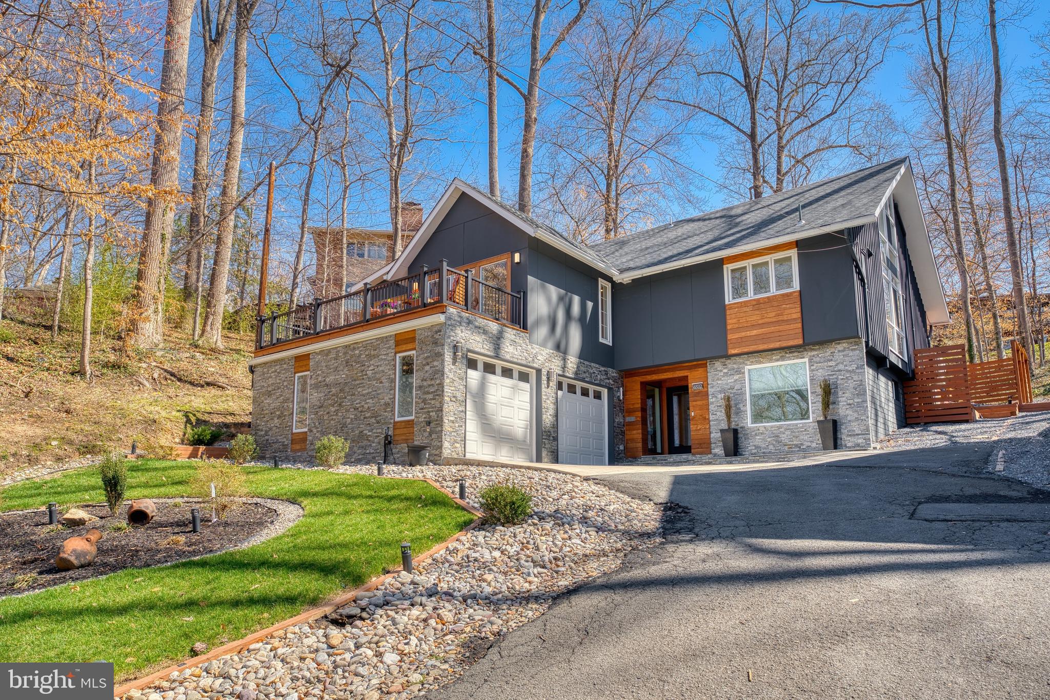 REPRICED To Sell!! Open House Canceled, the home is now under contract.
Recently updated, move-in ready with modern finishes!
Welcome to 6522 Walhonding Rd, a stunning and spacious mid-century modern, recently updated 6-Bedroom, 3.5-bathroom home located in the sought-after neighborhood of Glen Echo Heights, Bethesda, known for its top-rated schools and part of the Walt Whitman High School cluster. The current owners have made countless upgrades and have elevated this property into a true masterpiece of modern living. They have expanded the living space by adding two extra bedrooms, an extra living room, expanded the kitchen, added an insulated air-controlled 2 car garage and two gorgeous decks for relaxation and entertainment. The electrical panel was upgraded to 200-amp to support modern appliances and a tankless water heater was added for the convenience of hot water on demand.
The front-yard smart watering system makes irrigating your front yard effortless, with convenient app-based control and a new drainage system in the backyard make this home not only water efficient but also ensures ease of maintenance. Enjoy great sun exposure throughout the day making this home welcoming and perfect for those who love natural light.
As you enter the home, you're welcomed by a family room/recreation room, two bedrooms, a full bath, an upgraded laundry room and a foyer. Access to the garage is also on this level. As you move to the main level, you're greeted by an open floor plan featuring not one, but two living room areas, a modern kitchen, a dining area, and access to both the front and back decks. The primary bedroom featuring an en-suite bath and walk-in closet, is also located on this level along with a half bath and a third bedroom with deck access. As you walk up to the third level, you'll find two additional bedrooms each featuring oversized floor-to-ceiling windows along with a full bathroom.

This home offers convenient access to shopping, great restaurants and recreational amenities. Ideally located for those who commute into DC or Virginia (with easy access to I-495). The Sangamore Shopping Center is just 1.4 miles away, and the new Westbard Square (currently under construction) is only 1.8 miles away. Enjoy nearby community pools, nature trails, kayaking, and quick access to major commuter routes. This home is also close to historic Glen Echo Park (0.7 miles), tennis courts at Cabin John Park (3 miles), and Sibley Hospital (2.3 miles). Additionally, you'll have easy access to the nearby C&O Towpath, which connects to Georgetown and the DC area by bike or car. Reach out for a full list of home updates and don't miss an opportunity to make this incredible house, in an unbeatable location, your home!