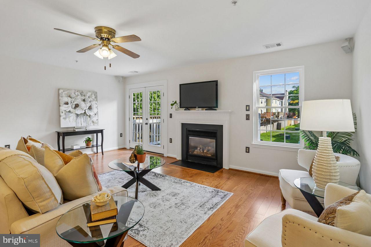Beautiful three (3) Bedroom, 2 1/2 bath townhome in sought-after Crofton. Freshly painted with brand new carpet. Bright and open first floor. This sunny and welcoming home offers comfortable living throughout. You will love the bright and sunny kitchen offering  a breakfast bar perfect for your morning coffee and tea.  Abundant sunlight and large bay window overlooking a lush dogwood tree.  Kitchen is great for baking, too.  The spacious living room is highlighted by a lovely gas fireplace with mantel. Especially cozy in the winter months. Living room opens to great rear deck for grilling and entertaining family and friends. The lower level includes a laundry room , walk out, and additional storage space for added convenience. Parking is TWO PARKING SPOTS directly in front of your home. Tons of storage - walk in primary, linen closet, closets and shelving, including around laundry. All new windows- energy efficient, swing-in - pop in screens -2022. All new stainless kitchen appliances 2022- oven converts to two. This desired Crofton community boasts an impressive array of amenities including 2 swimming pools, tennis courts, basketball courts and volleyball courts, a tot/lot/playground, jogging and walking paths, lawn care and more! Conveniently located close to DC., Annpolis, and Baltimore provides easy access to major Cities and BWI airport. Great shopping two minutes away, close to all the main roads.