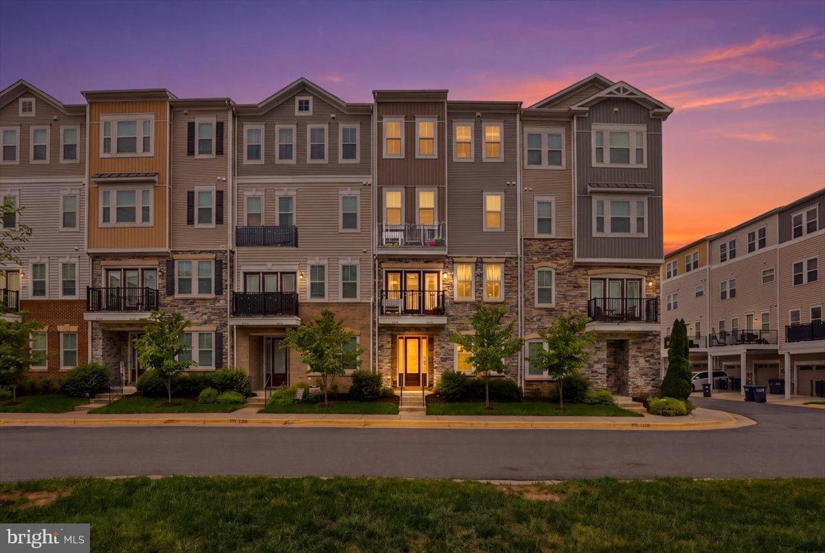 Welcome to 42045 Berkley Hill Terrace in the sought-after Stone Mill Corner community of Stone Ridge! This beautifully designed 4-level condo townhome offers over 2,200 square feet of stylish and functional living space with 3 spacious bedrooms, 2.5 bathrooms, and a 1-car rear-entry garage.

Built in 2017 by Van Metre Homes, this contemporary “Woodson” model features an open-concept floor plan ideal for both everyday living and entertaining. The main level showcases hardwood flooring throughout the home, an expansive living and dining area, and a gourmet kitchen complete with granite countertops, a large center island with pendant lighting, upgraded stainless steel appliances, gas cooking, double ovens, and abundant cabinet space. Step outside to a private composite deck — perfect for morning coffee or evening relaxation.

The luxurious primary suite occupies its own private level and includes a custom-built walk-in closet with a California closet system and spa-inspired en-suite bath with dual vanities, soaking tub, and separate shower. The laundry is also conveniently located at this level with upgraded washer and dryer. The upper level features two additional generously sized bedrooms, with ceiling fans and a full bath. The entry level offers flexible space ideal for a home office, gym, mudroom, or recreation area.

Additional upgrades and features include custom 2" wood blinds with fabric tape, upgraded level-5 carpeting and padding on stairs, recessed lighting, Hunter and Kichler ceiling fans with remote controls, upgraded bathrooms with floor-to-ceiling tiles and luxury-height toilets, upgraded powder room appointments, an insulated garage door, and ample storage throughout.

Residents of Stone Mill Corner enjoy access to Stone Ridge’s outstanding community amenities, including multiple pools (one saltwater pool), clubhouse, fitness center, tennis and basketball courts, walking trails, parks, amphitheater, and playgrounds. Conveniently located near shopping, dining, commuter routes, Dulles Airport, and top-rated Loudoun County schools.

This is better than any New Construction at a better price
Modern comfort, thoughtful upgrades, and an unbeatable location — this is the one you’ve been waiting for!