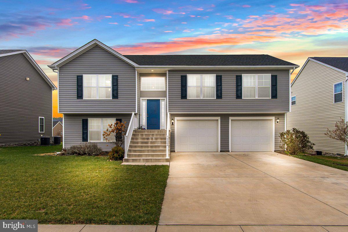 5 year young split foyer in popular Red Hill! Upstairs has an open floor plan featuring vaulted ceilings, a gorgeous kitchen with center island, quartz countertops, SS appliances & shaker style cabinets & living and dining areas with amazing natural light throughout. 3 BDRMS, 2 full BA on upper level including the owners suite with luxury bath-dual vanity, makeup station & tub/shower combo. Lower level is fully finished with full size windows  & could be a spacious family room or a lower level bedroom suite with full bath. Laundry room/utility room on lower level as well. OVERSIZE 2 car garage you will LOVE-plenty of room for 2 vehicles plus tons of extra space space in the rear for storage, toys, workshop, etc.! Great flat lot + rear deck to relax and enjoy the outdoors & those mountain views!! Close to Hedgesville High School, Rt 9, I-81, shops, dining & more!