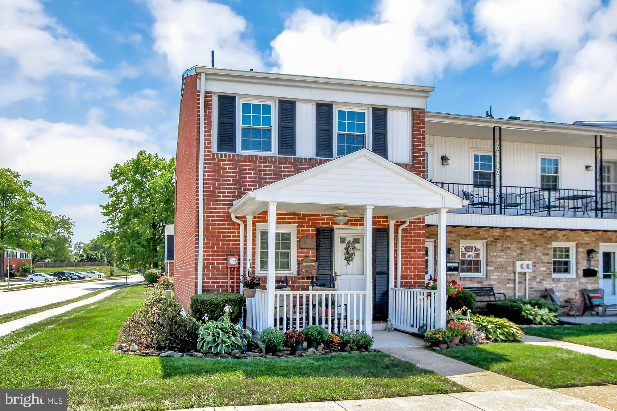 Wow!This wonderful END unit with updated         windows, doors, updated heating and central air  conditioning,  new carpet, newly painted, newer  appliances, updated bathroom and kitchen! One of only four of the condos with a front porch and rear fenced patio and directly across from the      community pool and play ground!  Public                      transportation  is also available! Conveniently      located to I-83 and Rt 30   restaurants and                shopping!  Small storage shed included! Move in   ready and waiting for you!!!