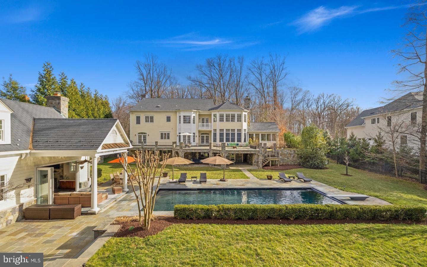 Custom built in 2006 and inspired by the country estates in Pennsylvania, this property was crafted for luxurious living and grand scale entertaining. This colonial style home underwent a complete top-to-bottom renovation that completed in 2024-25, consisting of high-end materials and finishes. Featuring top-grade Italian marble, refinished wood floors, solid wood doors throughout, crystal chandeliers, four-inch recessed lights, all new bathrooms and fixtures, and porcelain tile lower level floors.

The gourmet kitchen with a full suite of high-end appliances and large island connects with an eat-in breakfast table, adjacent to the great room with 11’ ceilings, surrounding windows, and access to the screened-in porch. An elegant formal dining room adjacent to the living room and kitchen comfortably hosts more than 15 guests, with outside access onto the expansive rear slate terrace through French doors. The terrace overlooks the professionally landscaped grounds, an outdoor heated and saltwater pool with cover, and a complete guest/pool house with a living room, kitchenette, two bathrooms, a bedroom, and laundry - providing all living necessities. The primary bedroom on the second level of the main home spans the entirety of the rear and includes a sitting room, balcony, breakfast bar, custom walk-in closets and changing room, and a large bathroom space with a steam shower and soaking tub. Three other bedrooms with adjacent bathrooms are on the second level as well as a sitting room area and laundry room. The top level includes a private sitting room connecting to the fifth bedroom. The lower level offers an expansive area with walkout to the rear garden and having multiple spaces for everyday living; a kitchenette connecting to a large second family room with a gas fireplace, AuPair suite, exercise room, recreational room, home theater room, creative room, and storage space. A three-car attached garage enters into the mud room on the main level, with a vast amount of additional parking available around the wide circular driveway. 

Conveniently located approximately halfway between the Potomac Village and the Congressional Country Club, the property offers easy access for anyone traveling to Washington DC, Tysons Corner, Bethesda, and the Dulles and 270 business corridors. Reagan National and Dulles International Airports are approximately 35 minutes away. There are excellent public and private schools, seven universities, and renowned medical facilities in the area. With nearby walking amenities that include Potomac Village, Avenel Park, and Heritage Farm Park, this home offers the best of Potomac living.