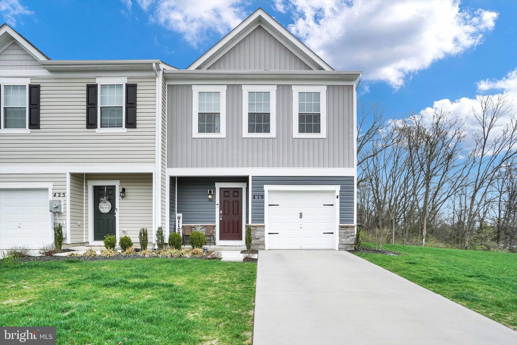 Welcome to 415 Locust Run Dr.  This end-unit townhome comes with an extended driveway and a fully finished garage, offering versatility for your hobbies and interests. Step outside to an oversized, upgraded patio with beautifully paved surfaces, perfect for outdoor relaxation and entertaining. Just a short walk away, you'll find a cozy campfire area featuring a firepit, ideal for enjoying warm evenings under the stars. A perfect blend of convenience, comfort, and outdoor living!  These units have proven popular.  You will love this one the MOST!  Schedule your showing today!