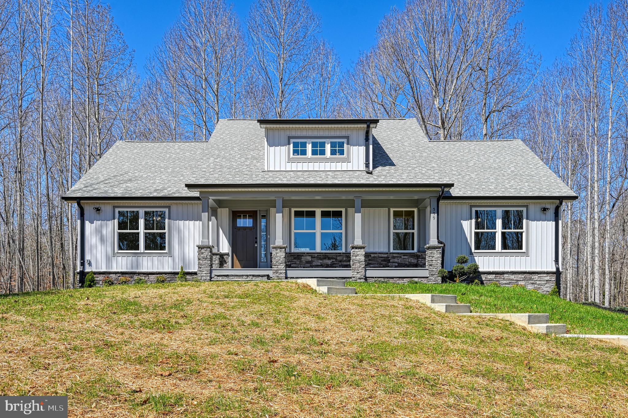 Build Complete, Home is READY! Welcome to 559 Overton Road, a brand-new Craftsman-style home featuring 4 bedrooms and 3 full bathrooms, located on the private side of Lake Anna in the desirable Overton Fork community. This thoughtfully designed home offers exclusive lake access, a boat slip, and is just a short walk to the common area with all the amenities you need to enjoy lake living to the fullest.

Set on a one-acre lot that backs to trees, this property offers beautiful views and a lake lifestyle. The exterior has been beautifully finished with extensive hardscaping, including retaining walls, professional landscaping, and a concrete walkway that leads to the covered front porch. Exterior lighting highlights the architectural features of the home and creates a warm, inviting atmosphere in the evenings. Every detail has been considered, making this home move-in ready both inside and out.

Inside, you’ll find upgraded finishes throughout. The open floor plan features luxury vinyl plank flooring, lush carpet, upgraded lighting fixtures, and an abundance of natural light. The kitchen offers upgraded countertops, a center island, stainless steel appliances, and a walk-in pantry. The living room is centered around a cozy gas fireplace, perfect for relaxing after a day on the water. The primary suite features a spa-like en suite bath with a soaking tub, walk-in shower, and large walk-in closet.

The fully finished walkout lower level adds even more living space and versatility to this home. It includes a large recreational area that’s ideal for a game room, home theater, or additional family room. There is also a fourth bedroom, a full bathroom,  and a bonus room. With multiple access points to the outdoors, this level seamlessly connects to the backyard, making it perfect for entertaining.

Additional features include a side entry two car garage with gorgeous doors and extra storage space. A paved or concrete driveway upgrade option is available at a separate cost, ask us for more details. 

Overton Fork is a lake-access community on the warm, private side of Lake Anna. Homeowners enjoy access to a private common area with a beach, boat launch, swimming, fishing, and water sports. This home includes a boat slip, giving you easy and direct access to everything Lake Anna has to offer.

If you’re looking for a brand-new home with upgraded features, private lake access, and a boat slip, 559 Overton Road is ready for you.