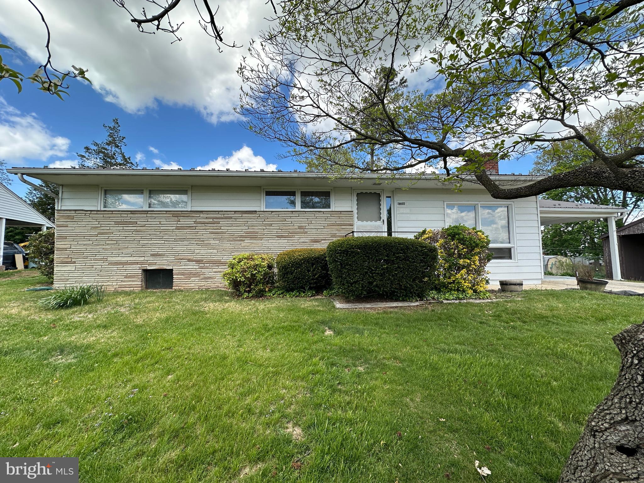 NICE RANCHER IN HAGERSTOWN, MD!  Welcome to this well-maintained home located in the Greenberry Hills neighborhood. This inviting rancher features 3 bedrooms and 1.5 bathrooms, along with a comfortable layout that includes a cozy family room with a wood stove, a dining room, and kitchen. Enjoy additional living space in the spacious sunroom—perfect for relaxing or entertaining. The full partially finished basement includes a family room and den as well as plenty of storage space, while the attached 1-car carport adds everyday convenience. Step outside to a nice, spacious backyard ideal for outdoor enjoyment. Recent updates include a new roof in 2021 and a new AC unit in 2025, providing added peace of mind. Conveniently located just minutes from I-81, I-70, and Route 11, and only minutes from Valley Mall with shopping, restaurants, and more. Don’t miss your opportunity to make this home your own!