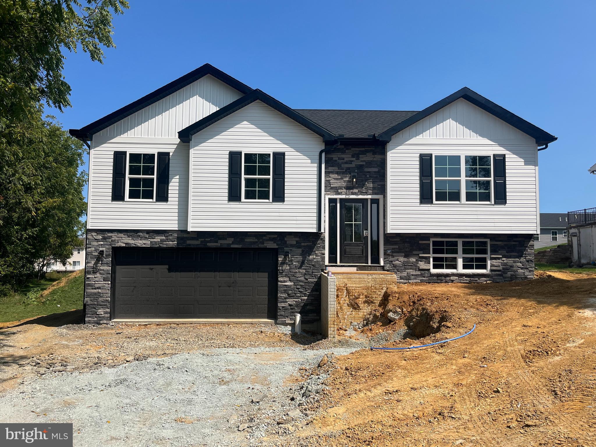 Welcome to Antietam Commons! Ashlyn Homes is offering 3 different split foyers on Benning Ave. Lot 23-house is currently under construction, and are slated to be finished 9/1/2026-10/1/2026. Prices start at $314,900, and the seller is offering $2,000 buyers paid closing cost! See the photos for the exterior of houses & colors. Lot 23 is white and black exterior. Interior photos are of a similar house. Each home features an open concept kitchen (island included), dining, and living room areas. All Kitchen appliances included. Granite Countertops, LVP flooring through out, except for the bedrooms, which will have carpet. The master bedroom features its own private bath, along with a closet. Full Poured concrete foundation. Central A/C and Electric Heat pump, and a 12x12 composite deck off the rear. The lower level family room/ bedroom area, and bath will remain unfinished at the list price. Builder can finish it to match the rest of the property for an additional $20,000. Work can be completed prior to settlement, so you won't live in construction debris! Call today to find out more about this new construction single family home!