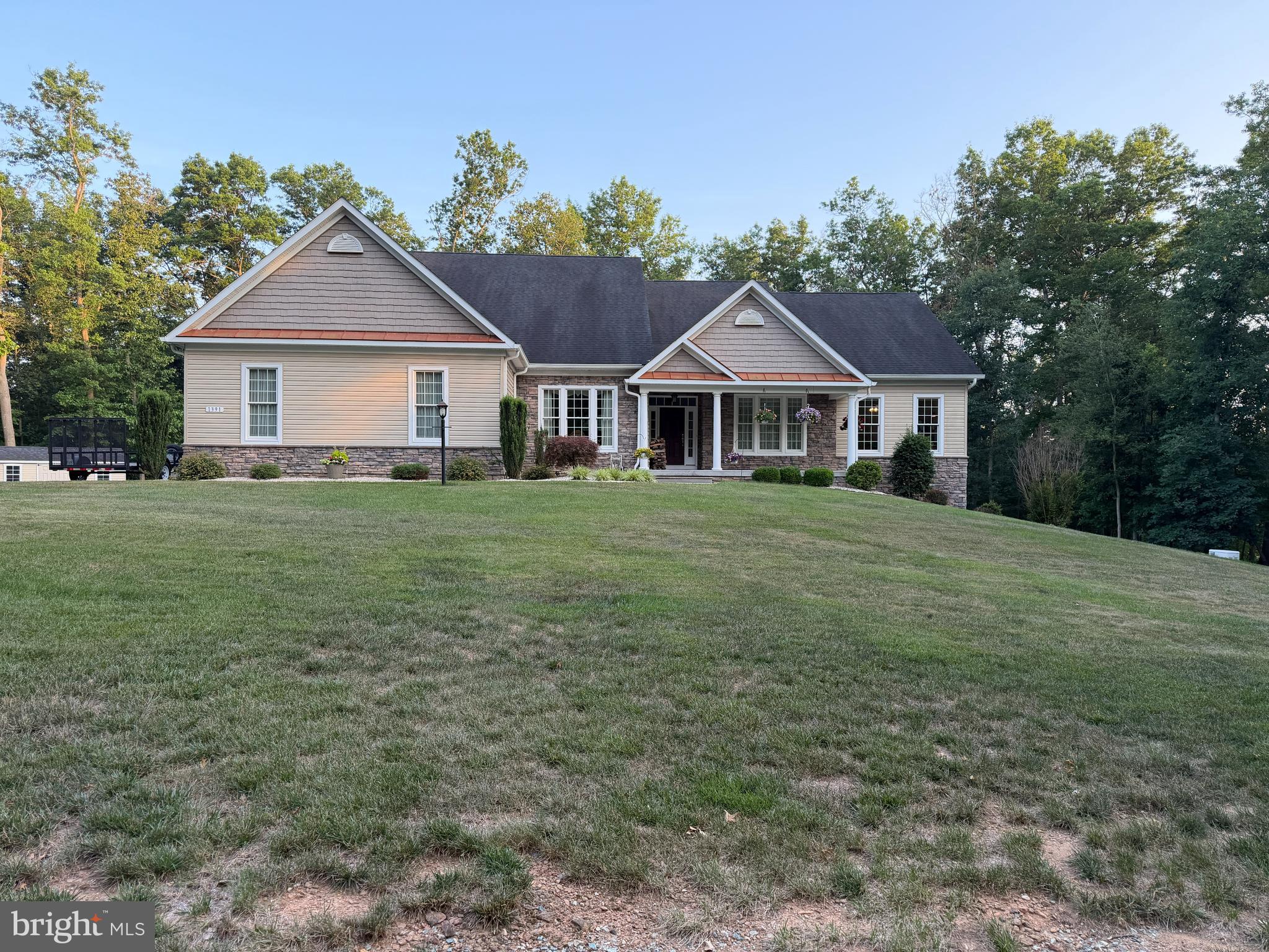 1391 MACTON ROAD, STREET MD. 21154 4 BEDROOM, 3.5 BATH, 4003 SQ FT., BUILT 2015 $ 949,900.00 4-Bed, 3.5 Bath, Beautiful Craftsman Style Rancher on 9.18 acres on Broad Creek, 4003 sq. ft. total finished, (3004 first fl., 1000 lower level). Lower level has one of the four bedrooms and one full bath. 3 car oversized 972 sq. ft. garage with stairwell to basement. Garage also has a 30,000 BTU wall-mounted propane heater, directly connected to the house propane system. Lower level has a full bath. Possible as a 4th bedroom. Exercise room lower level. The first floor has a very high- end kitchen with Silestone counters and a 48 inch, GE Monogram double oven/range. High end master bath with heated floor. Beautiful Office area on the main level looking out over the back lawn and wooded area. Has 2000 sq. ft. of storage in lower-level unfinished area. Dual heating and Air cond. with filtration system and two Honeywell WIFI thermostats. Anderson 400 Series windows and Anderson exterior doors. Kitchen has 42 inch Kraftmaid soft-close cabinetry, drawer stacks, spice racks etc. Kitchen area also has an oversize pantry, oversize mud room and oversize laundry room. Laundry room and lower-level exercise room have cork floors. Entire main level has Premium Hardwood flooring, except baths which have tile floors. Master bedroom has a California Closet System installed. The other 2 bedrooms also have large enclosed closets. House has Fiber Optic service. Outside has oversized commercial gutters and downspouts with underground drainage pits on all 9 spouts. Architectural Roof 40-year shingles. Garage has Clopay doors with battery-backup openers. Lower level has a separate expansion electrical breaker box in the water room. House has two extra dedicated refrigerator/freezer receptacles. Full upgrade front porch. There are five (5) ceiling fans, three tray ceilings and a cathedral ceiling in the great room. There are many cleared trails on the property, including along all the property lines and a vehicle-drivable trail down to Broad Creek . Can be adapted for horses on about 2 acres of the 9.18 acres. ONLY 1/3 OF AN ACRE OF LAWN TO CUT. Ground-level double doors on the lower level. 16kW Generac Whole-House auto switchover Generator. Owned 1000 gal. underground Propane tank. 20 by 12 shed with electric and an 18 by 20 covered pole barn ready for enclosure or whatever. Reverse-Osmosis water filter at kitchen sink as well as a whole-house sediment filter. Wet bar and wine cooler at dining room area. MUST SEE THIS EXCEPTIONAL HOME !!!