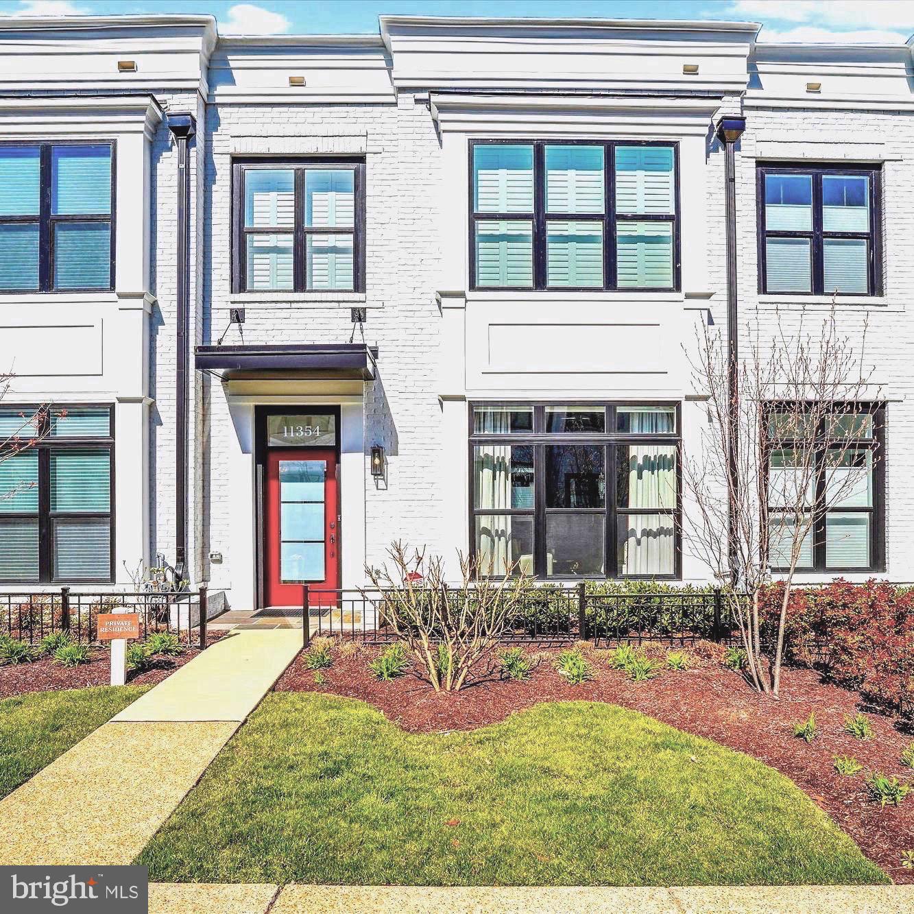 Welcome to this gorgeous,  4 level garage townhome located in the newly revitalized Cabin John Village. No need to wait for your new home to be built, this less than 3 year old home offers all of the options you would desire, and is move in ready. Enjoy the convenience of stepping out to either the walking trails of Cabin John Park, or to the array of many new restaurants, and an abundance of shopping, services and businesses. This home is ideally located at the PARK end of the community, offering a view of trees from the rooftop terrace. From the moment you walk into this home, you will be awed by the gorgeous statement wall with gas fireplace, and then onto the beautifully designed kitchen with high end Wolf and Bosch appliances, and a large quartz island for all to gather. This Cypress model, built by EYA is approximately. 2700 sq ft, has 4 Bedrooms, 3 full Baths and 2 Half baths. The loft level with custom built-ins and bar, and large glass door to rooftop terrace is the ideal entertaining space. Create your oasis with seating and a fire pit protected from sun and rain with an by an added retractable awning. This level also has and additional bedroom and full bath.  The lower level has the entrance from the 2 car garage, recreation/workout room, additional powder room and lots of storage.  So many upgrades including; kitchen design and appliances,  statement wall with gas fireplace, custom built-ins and closets, luxury flooring, custom window treatments throughout, recessed lighting, plus more. Come enjoy all the conveniences and location this home has to offer.