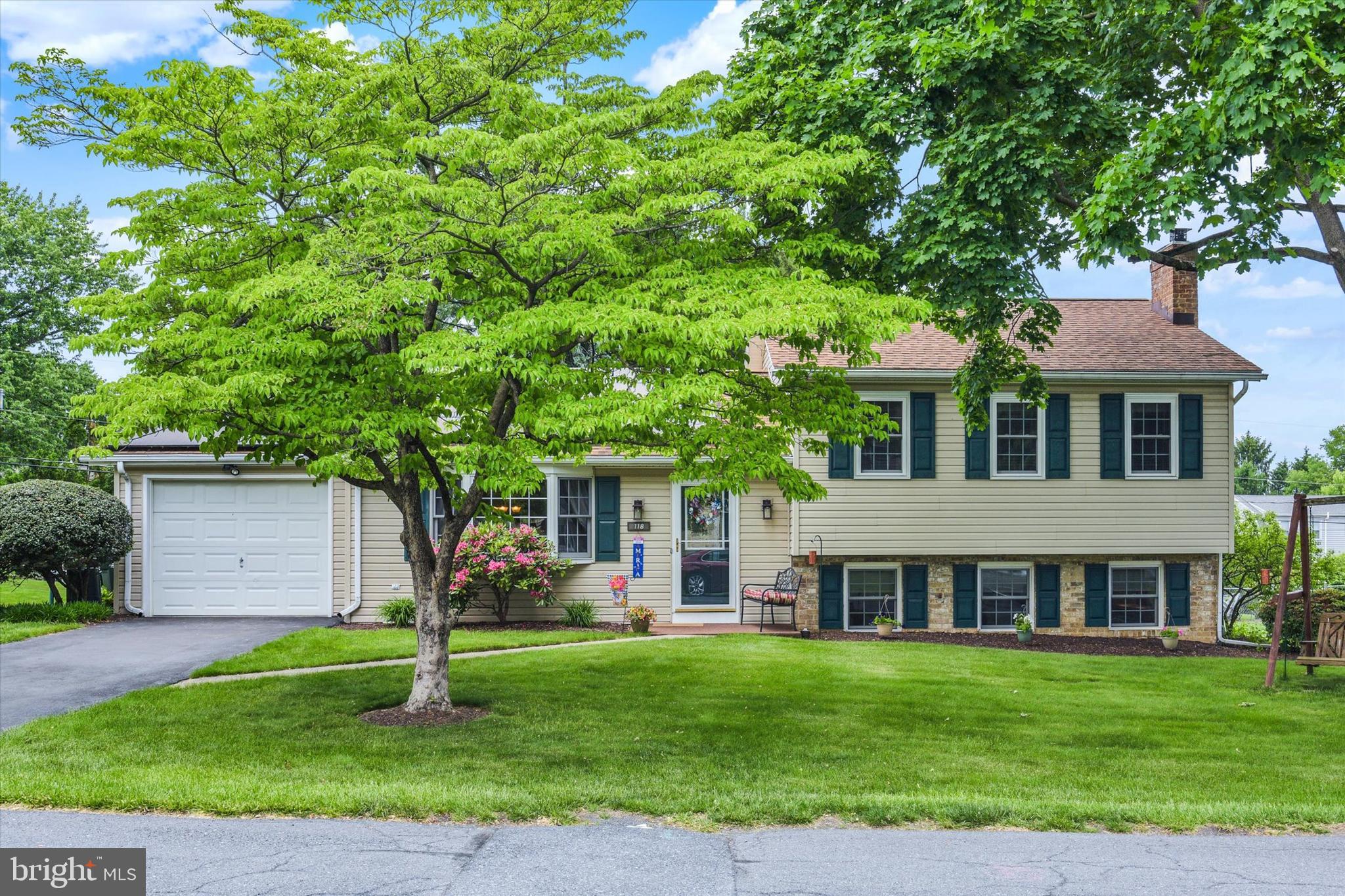 Welcome home to the desirable Kimberly Acres community in the highly sought-after Mechanicsburg School District! Meticulously maintained throughout the years, this beautiful home is truly move-in ready. Step inside to a spacious living room highlighted by a large bay window that fills the space with an abundance of natural light. The updated kitchen is both stylish and functional, featuring heated tile floors, 42” cabinetry, a lovely backsplash, and a skylight that brightens the heart of the home. Just off the kitchen, the dining room showcases beautiful hardwood floors and a charming built-in corner cabinet. Entertaining is effortless with the attached screened-in porch overlooking the beautifully landscaped backyard. Step outside onto the brand-new composite deck, perfect for grilling and gathering with family and friends. Upstairs, you’ll find three bedrooms with beautiful hardwood flooring, including a spacious primary with a private ensuite bath. A full hall bathroom completes the second floor. The lower level offers a generously sized family room centered around a cozy gas fireplace, creating the perfect retreat for chilly winter evenings. Adjacent to the family room is a fourth bedroom, currently used as a home office, along with a separate laundry room offering plenty of additional storage space. Major updates include a newer roof (2019), composite deck and railing (2024), water heater (2023), A/C unit (2026), and shed roof (2026). Conveniently located near shopping, restaurants, parks, and major highways, this exceptional home is ready to welcome its next owners!