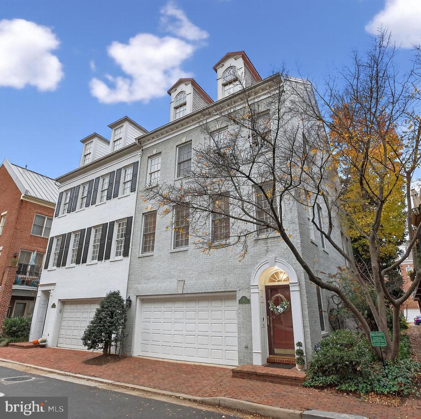 Welcome to 16 Wharf Street, Alexandria, VA—a stately end-unit townhome embodying classic Federal style architecture. Spanning 3,000 square feet across four levels, this residence offers an elegant blend of space and comfort. The home features three bedrooms and three and a half bathrooms, with the primary suite boasting vaulted ceilings for an airy ambiance. A marble fireplace serves as a sophisticated focal point in the living area, while abundant natural light floods the interiors, enhancing the home's inviting atmosphere. Relax on the rear deck or brick patio and enjoy the view into the grass courtyard, the only one in Fords Landing. 

Located within steps to the scenic Potomac River, this property offers easy access to the vibrant King Street corridor, renowned for its history, and diverse dining and shopping options. Enjoy leisurely strolls along nearby walking paths or relax in the private courtyard. This prime location combines urban convenience with serene living, making it an ideal choice for discerning buyers. Experience the perfect blend of luxury and location at 16 Wharf Street. 2022 Hot Water Heather; 2021 HVAC Upper level- new capacitor and motherboard; 2023 New HVAC lower level