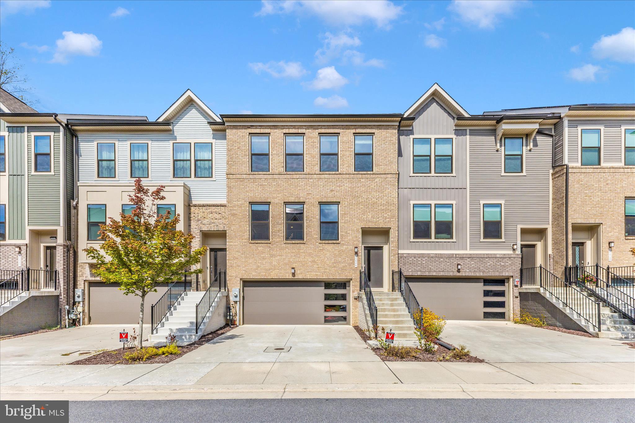 REVISED PRICE  - BETTER THAN NEW townhome Located in the sought-after Watershed community, this fashionable 3 level townhome blends luxury features and comfort in a  beautifully designed living space. A true PREMIUM location within the community, this home backs to a luxuriously private of mature hardwood trees.  Very few homes in this community have that benefit.  Enjoy a stylish kitchen with bright windows overlooking the rear view. Espresso contemporary cabinets topped with Quartz, stainless steel appliances, and a large center island that opens to the dining and gathering rooms. Upstairs, the owner’s suite features a walk-in closet and spa-inspired bath with dual shower heads all overlooking that unique private view of peace.  Two additional bedrooms and hall bath complete the upper level. The fully finished walkout lower level allows plenty of space for a home office, gym, or guest suite. The 2 car garage is a convenient front entry with stair to the main level of the interior.  Gutter guards installed in 2021. This home is in pristine condition.  Watershed residents enjoy resort-style amenities including walking trails, playgrounds, pools and a clubhouse all just minutes from major commuter routes, shopping, and dining.