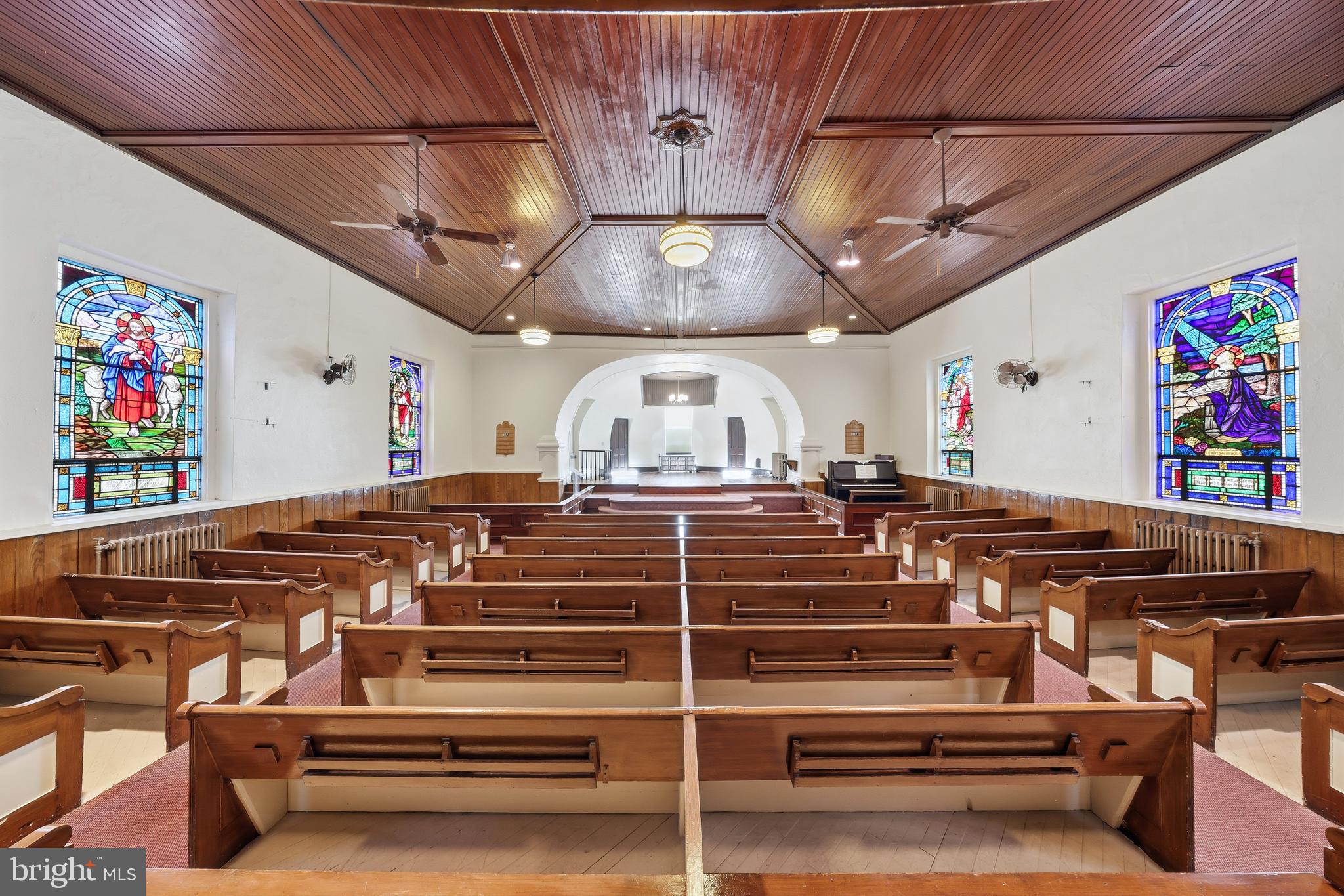 Beautiful church property offering timeless architectural charm and immediate occupancy. This well-maintained house of worship features many original details, including stunning stained-glass windows, a prominent bell tower, soaring ceilings, and classic ecclesiastical design elements that create a truly inspiring setting. The interior has been freshly painted and is move-in ready for a congregation, religious organization, community group, or other permitted use. The property's character has been carefully preserved while providing a clean, welcoming space for its next owner. Situated on a substantial parcel at 4601 Almond Street, the property offers excellent visibility and accessibility within a well-established Philadelphia neighborhood. An adjoining cemetery is included with the sale, providing additional land and open space. Conveniently located near major roadways, public transportation, and surrounding residential communities, this is a rare opportunity to acquire a distinctive church property with original architectural features, immediate usability, and significant community presence.