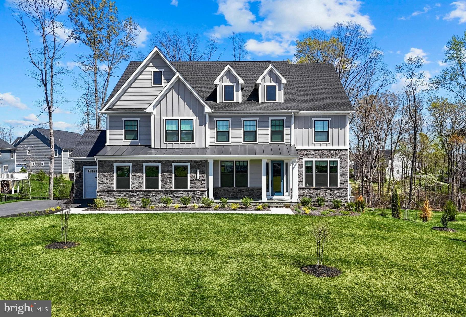 Spectacular Dream Home in one of the most prestigious addresses in the Fredericksburg area. Located within the gates of Fawn Lake, this ​sophisticated, beautifully appointed turn-key residence, featuring a ​modern, elegant and flowing interior with upgraded finishes was designed for both luxurious daily living and impressive entertaining. Exquisite finishes such as 10 FT ceilings, tall windows, custom tile, and wide plank wood floors elevate the ​voluminous spaces throughout this gorgeous home.
The impressive facade with stacked stone and black-framed windows combined with board and batten siding​, create a modern aesthetic that leaves a lasting impression. The welcoming flagstone front porch leads to an inviting Foyer, which is anchored by a Formal Living Room that can serve as an optional Study, and a fabulous Dining Room with an ​incredible Butlers Pantry​ right  around the corner. 
A spectacular Great Room with a soaring two-story coffered ceiling​ with an amazing chandelier, and a dramatic wall of windows overlooking the wooded back yard, opens to the amazing Chef's Gourmet Kitchen with an abundance of upgraded Cabinetry and Quartz countertops, a massive center island, tile backsplash, ​upgraded stainless steel appliances and a large walk-in pantry. 

​A gracious main level Bedroom with a beautiful private bath and walk-in closet is perfect for guests.  
A large Mud Room with a convenient drop zone completes the main floor.

The​ wide staircase leads to the upper level ​bedrooms. A perfect sanctuary, the fabulous Owner's Suite with ​sitting area, features a luxury Spa Bath with tile shower and double vanities, plus an amazing walk-in closet! 
T​hree Generous ​en-suite Bedrooms with Full Baths and walk-in closets​ offer ample space for the whole family. ​The large laundry room with a utility sink is conveniently located on the upper level. A ​long balcony overloo​ks the luxurious space below.

The finished walk-out basement continues to impress. Designed with abundant comforts and features to entertain, it features a ​huge Recreation Room​, lounge, Gym, Full Bath, and ​an amazing Bar with beverage fridge, sink and dishwasher.
The covered porch, overlooking the backyard which abuts to a wooded conservation area, is perfect for extended outdoor living, alfresco dining, and entertaining!

The grounds are easily maintained with the in ground irrigation system.  Complete with an oversized 3-Car Garage!  Located within walking distance to the Fawn Lake Marina!
You will live with ease in this luxuriously beautifully designed turn-key dream home built in June 2024!
 Don't miss this incredible opportunity to own a newer Home in one of the most prestigious addresses in the Fredericksburg area!

The beautiful Luxury Fawn Lake Community offers amazing amenities such as a boating recreational lake, beach, Arnold Palmer designed golf course, tennis courts, baseball and soccer fields, dog park, volleyball courts, walking trails, Community ClubHouse, marina, fitness center, restaurants, Country Club, playgrounds, and so much more! Located in the countryside near the town of Fredericksburg, surrounded by park lands and only a few miles to the farm market, wineries, and award winning breweries!