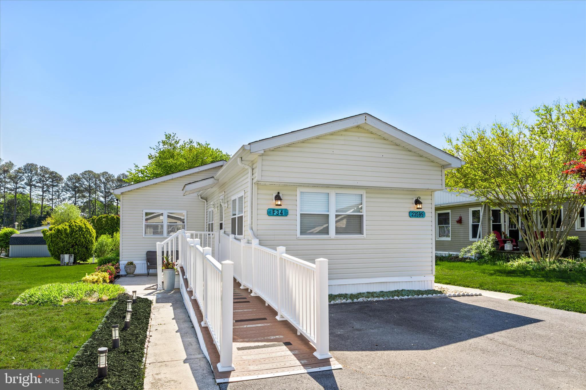 This well-cared-for 3-bedroom, 2-bath manufactured home offers a comfortable, easygoing lifestyle in the waterfront community of Angola Beach and Estates. Over time, the home has been thoughtfully updated, creating spaces that feel modern, practical and inviting.
The kitchen has been reimagined with new cabinetry, new counters, an attractive tiled backsplash,  an island,  and vinyl plank flooring that carries easily through the space. A creative dining area sits just alongside with a butcher block table. The adjoining living room includes a new cozy fireplace —and is well-suited for casual entertaining or quiet evenings at home. There's also a large addition, separated by sliding barn doors, with a large family room and an additional bedroom featuring storage shelves and a closet. The barn doors offer a touch of character while offering flexibility to use that room potentially as additional sleeping space or simply a quiet, private retreat. 
The layout follows a split-bedroom design, with the owner’s suite tucked toward the back of the home. It includes a wall of closets and a private bath with a generous linen closet.  The third bedroom sits at the front of the home, alongside a second full bathroom and coat closet. Outdoor spaces invite you to slow down and enjoy the setting, from the screened porch—now topped with a newer roof—to two patios that frame the home. A large shed with electric provides room for storage, hobbies, or beach gear, and a ramp with composite decking and vinyl railings offers added accessibility.
The home was briefly under contract, and during that time the seller took the opportunity to address items identified in an inspection, including improvements to the attic, underbelly, and electric. With those updates now in place, the home is all set to welcome you to your new coastal adventure!
Residents of Angola Beach and Estates enjoy access to two swimming pools, a floating marina, fishing pier, kayak and canoe storage, a fenced area for boats, RVs and boat trailers, and a community center with resident planned activities, along with tennis and basketball courts and a riverfront park. Residency is subject to park approval. Water, sewer and trash are included.in the low, $713/mo land rent..