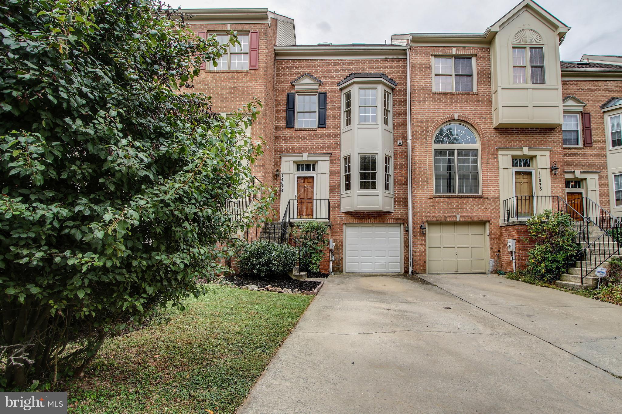 Stunning brick front townhome in Germantown!  This property is move-in ready with fresh paint and new carpet. The main level features upgraded eat-in kitchen with stainless steel appliances and granite counters. Open concept living and dining room with beautiful hardwood floors. The living room features 2 story vaulted ceiling, fireplace, and direct access to the large back deck. The upper level has 3 spacious bedrooms with 2 bathrooms. The master bedroom retreat features vaulted ceilings, walk-in closet, and ensuite with skylights, soaker tub, and double sinks. Fully finished lower level with additional rec space, half bath, garage access, and walk-out to back yard.  Conveniently located minutes to I-270 and public transit. Close to shopping, restaurants, and much more!