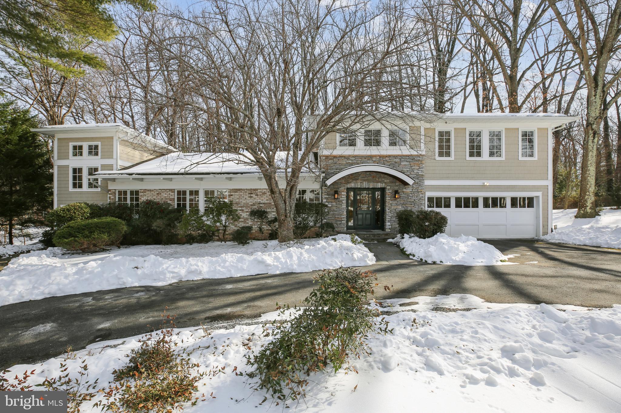 Offers due Thursday Feb. 12 by 3 PM. This modern craftsman home offers an open, light-filled space with private wooded backyard. Located in the sought-after Williamsburg Gardens neighborhood, walking distance to Potomac Village, this cul-de-sac home has over 6,400 sq.ft. of spacious well-appointed floor plan on three finished levels.  Completely reconstructed in 2003, the main level features vaulted ceilings, skylights, clerestory windows and a welcoming foyer, family room with wood burning fireplace and eat-in gourmet kitchen opening with a wall of glass to a large screened porch and backyard. A primary bedroom suite with separate sitting room and two walk-in closets, powder room, mudroom, as well as a dining room and living room complete the main level.
The upper level includes a sitting area, four spacious bedrooms, one jack-and-jill bath, and a full hall bath. A two-level office, with a vaulted ceiling, separate entry foyer and powder room, connects to the other end of the home. The fully finished lower level provides versatility with a generous open recreation room for entertaining, a sixth bedroom, full bath, two storage rooms, laundry and an office/exercise room with pocket doors and built-in shelving. Commuting is easy for this turn-key classic home via Persimmon Tree Lane or Falls Road to 495 or the Clara Barton Parkway. The C&O Canal and Great Falls Park are a short drive away, providing access to kayaking, biking and miles of scenic hiking trails.