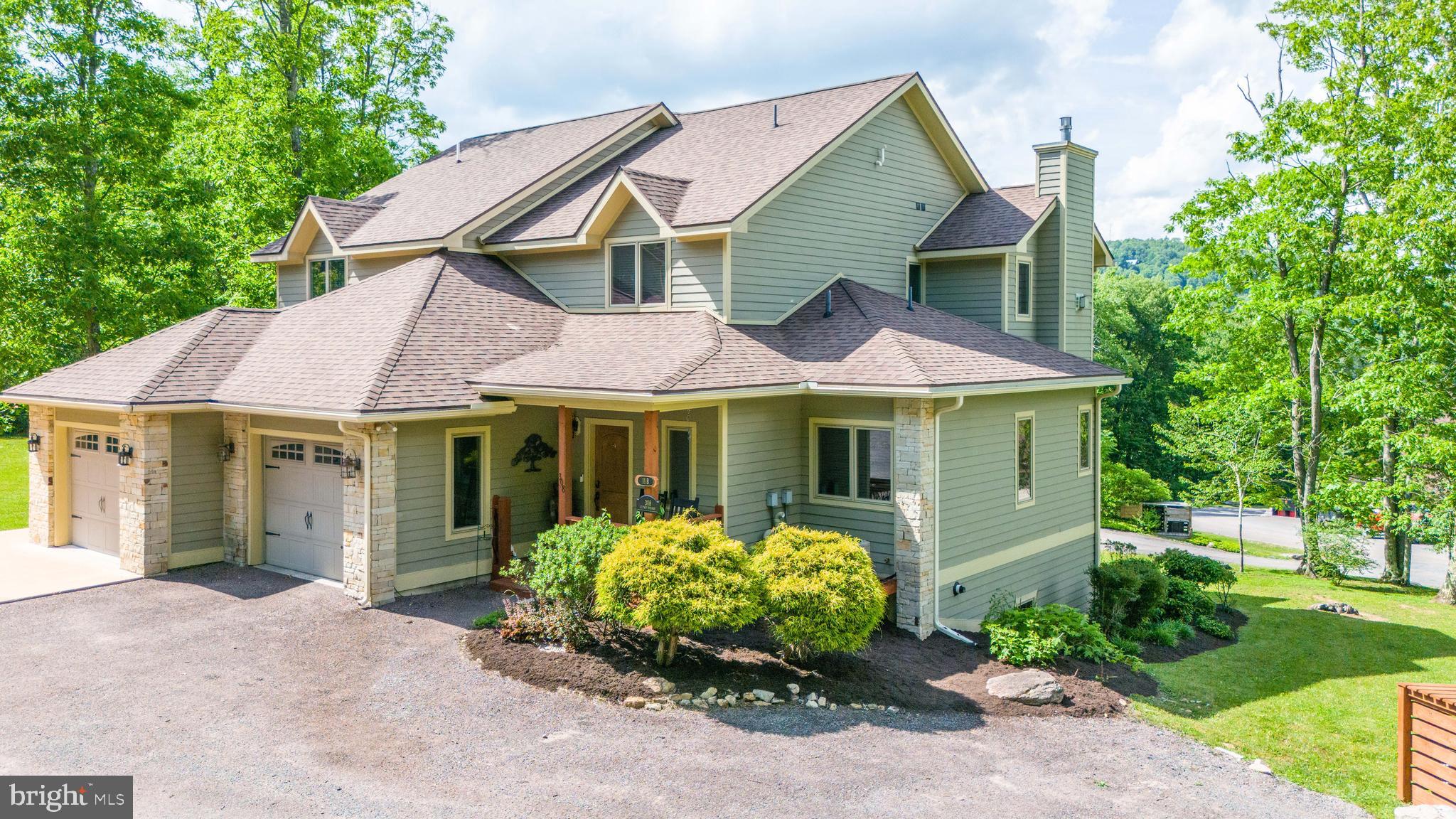 5BR, 4.5BA duplex with LAKE VIEWS! Enjoy  3300sf of living space in the heart of Deep Creek Lake. Features include 3 spacious suites, multiple stacked stone fireplaces and two living room areas, plus an impressive outdoor fire pit. You will love the open kitchen/dining area and the covered back deck. Other features include wood floors, granite, instant hot water, pool table and hot tub. Attached garage is a plus and over-sized yard area offers extra room to roam. Conveys furnished! One-time capital contribution of $1500 due at closing.