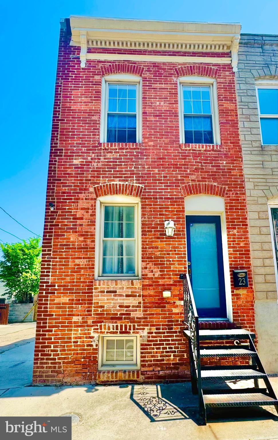 End-of-group rowhome just steps from Patterson Park. This light-filled home showcases gorgeous exposed brick, recessed lighting throughout, and beautiful hardwood floors on the main level, highlighted by a striking central staircase that anchors the space with character and charm.
The updated kitchen offers granite countertops, stainless steel appliances, a breakfast bar, and ample room for a full dining setup—perfect for everyday living and entertaining.
Upstairs, the spacious primary suite includes hardwood floors, a walk-in closet, en-suite bath, and a private balcony retreat. The second level also features an additional full bathroom, offering convenience and flexibility.
The lower level provides versatile living space—ideal for a second living area, guest suite, or home office—and includes a third full bathroom, making this home a rare find with 3 full baths total.
Located at the edge of Patterson Park, enjoy immediate access to over 300 acres of green space, trails, and city amenities. Previously featured on HGTV’s House Hunters.  Owner needs to do a rent back until the last week of June. Can park a small car (sedan or smaller) behind the house.