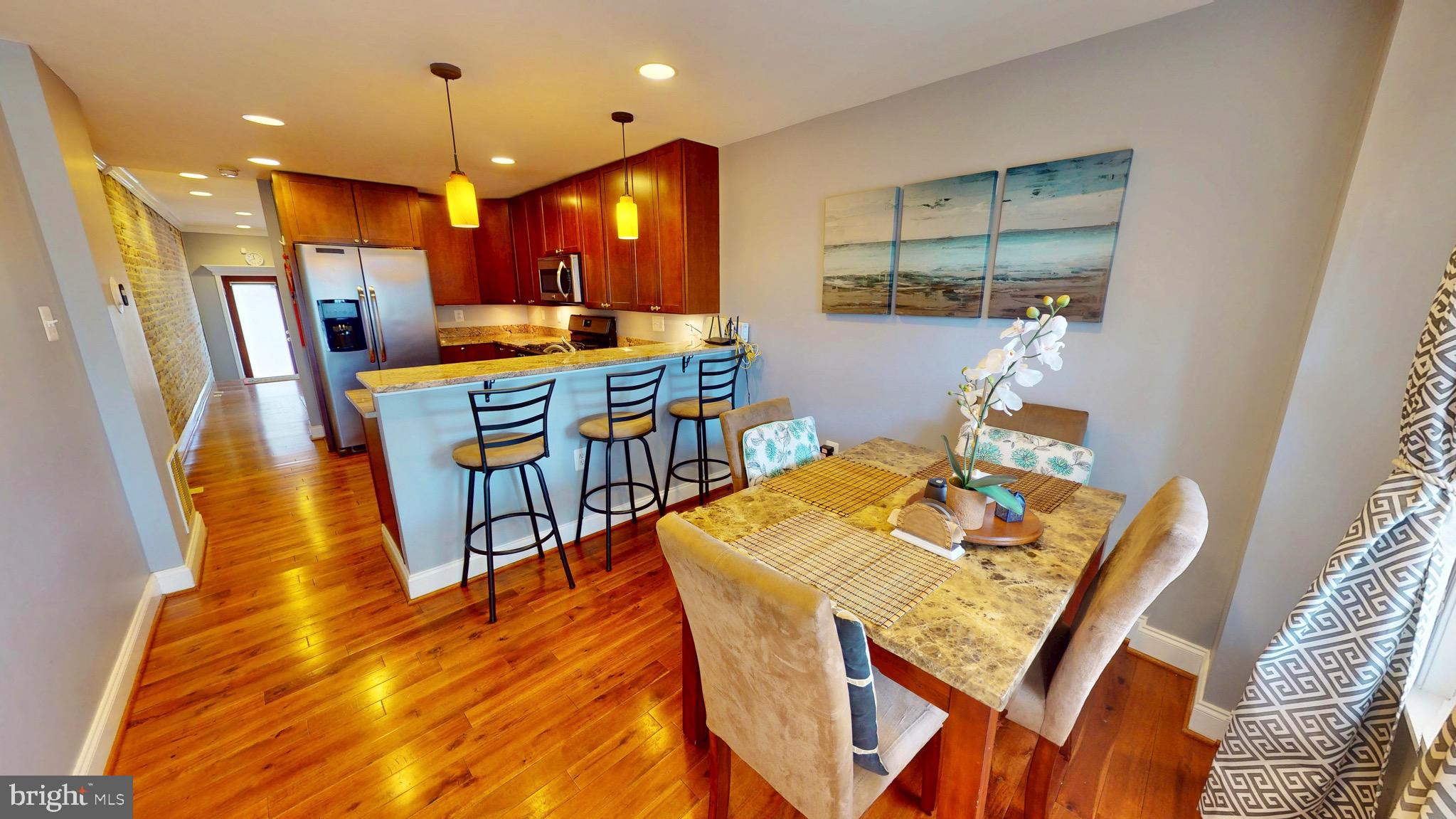 End-of-group rowhome just steps from Patterson Park. This light-filled home showcases gorgeous exposed brick, recessed lighting throughout, and beautiful hardwood floors on the main level, highlighted by a striking central staircase that anchors the space with character and charm.
The updated kitchen offers granite countertops, stainless steel appliances, a breakfast bar, and ample room for a full dining setup—perfect for everyday living and entertaining.
Upstairs, the spacious primary suite includes hardwood floors, a walk-in closet, en-suite bath, and a private balcony retreat. The second level also features an additional full bathroom, offering convenience and flexibility.
The lower level provides versatile living space—ideal for a second living area, guest suite, or home office—and includes a third full bathroom, making this home a rare find with 3 full baths total.
Located at the edge of Patterson Park, enjoy immediate access to over 300 acres of green space, trails, and city amenities. Previously featured on HGTV’s House Hunters.  Owner needs to do a rent back until the last week of June. Can park a small car (sedan or smaller) behind the house.