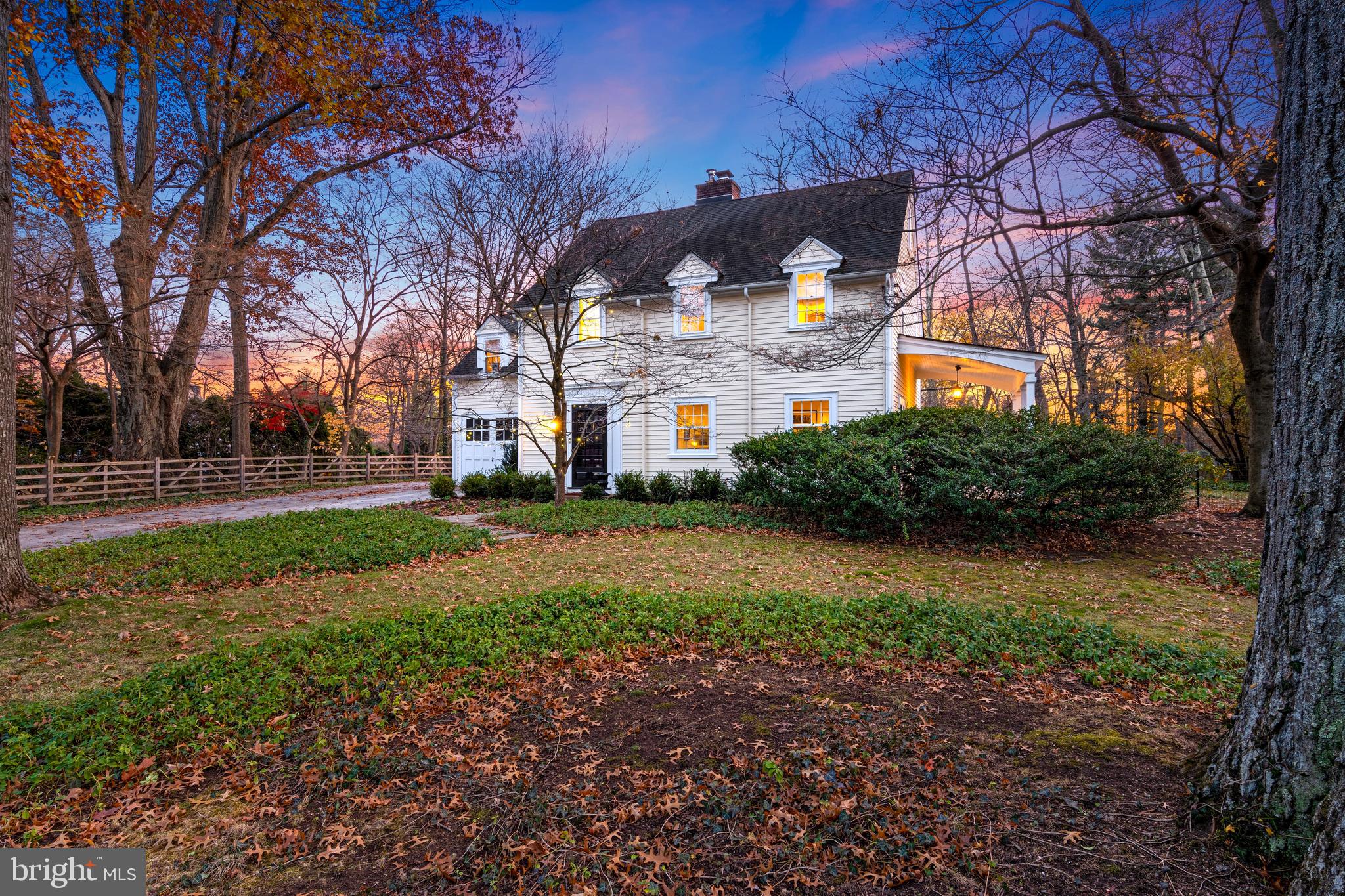 Set in the heart of Villanova, Pennsylvania, this idyllic four-bedroom, three-bath residence offers a rare blend of timeless design, thoughtful updates, and an extraordinary walk-to-everything location. Restaurants, the train, and daily conveniences are just steps away, while the home itself is anchored by an exceptional, nearly half-acre flat rear yard with a gracious terrace—ideal for both everyday relaxation and memorable entertaining.

Behind the classic white picket fence, a New England–inspired exterior welcomes you along a charming path to the front door. The home has been recently painted and expanded by the current owner, a well-regarded West Coast interior designer known for a refined, neutral palette and enduring selections that feel both chic and comfortable.

The entry foyer greets with a traditional turned staircase, deeply stained hardwood floors, and a glimpse into the inviting living room with its wood-burning fireplace. French doors from both the living room and the adjacent dining room open to a covered side porch, creating a seamless indoor-outdoor connection and enhancing the home’s natural flow for entertaining and everyday living.

The kitchen is a study in crisp, timeless design, featuring white cabinetry, black countertops, generous windows, and a seated dining area. Plentiful counter space supports both everyday living and entertaining, complemented by a suite of professional appliances. A convenient rear exit leads directly to the terrace and expansive backyard.

A spacious mudroom and family entrance thoughtfully manages storage with style, while a powder room adds everyday convenience.

Upstairs, four bedrooms and two full baths provide comfortable accommodations. The primary bedroom is adjacent to a recently renovated bath with a soaking tub and walk-in shower, designed to blend seamlessly with the home’s original aesthetic. Three additional bedrooms—two currently used as offices or sitting rooms—are bright and generously sized with ample reach-in closets. A secondary back staircase enhances flow and functionality throughout the home.

The mostly finished lower level offers flexible informal living space, along with laundry, craft, and gym areas. A full bath adds versatility, making this level ideal for guests or overflow living, and a Bilco door provides additional functionality and peace of mind.

This is a rare opportunity to own a home that balances classic charm, designer sensibility, and an unbeatable Main Line location—truly a place where timeless style meets everyday ease.