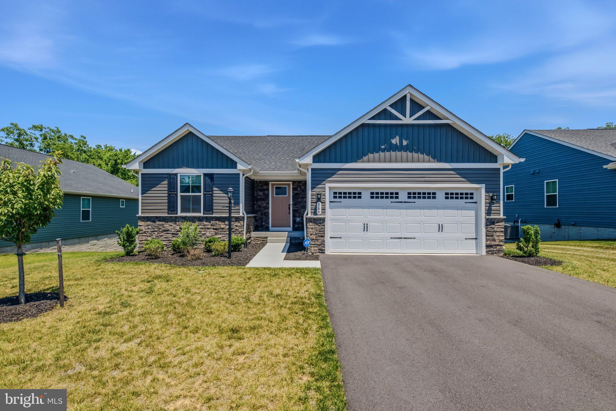 Why wait for new construction when you have a nearly new home ready for you now! This beautifully designed 3-bedroom, 3-bath ranch home offers comfortable one-level living with the added versatility of a full basement. The main level welcomes you with a spacious foyer that opens into a bright, open-concept floor plan featuring a large living room with recessed lighting and a ceiling fan, a dining area with recessed lighting, and a well-appointed kitchen complete with granite countertops and stainless-steel appliances. Luxury vinyl plank flooring flows throughout all of the main living areas, providing both style and durability. Bedrooms two and three offer plush carpeting, overhead lighting, and generous closet space, while the hall bathroom includes an extended single-bowl vanity and a tub/shower combination. The private primary suite features soft carpeting, a ceiling fan, and a spacious walk-in closet. Its ensuite bath is designed for comfort with a double-bowl vanity and a walk-in shower with a built-in bench seat. The partially finished lower level expands the home's living space with a large, carpeted recreation room, a full bathroom with a tub, and a walkout to the level backyard, offering endless possibilities for entertaining, relaxing, or accommodating guests. This home has everything you want and more - schedule your showing today!
