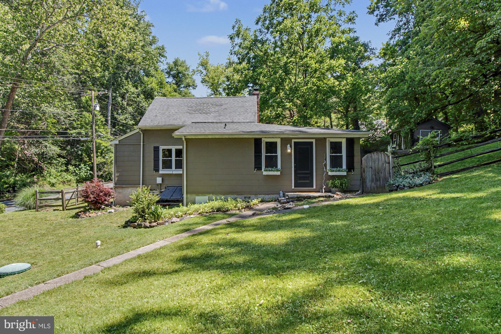 Tucked away on a tranquil 1.5-acre homesite backing directly to Gunpowder Falls State Park, this charming two-bedroom, one-bath Cape Cod offers a rare sense of peace, privacy, and connection to nature. Surrounded by mature trees and scenic beauty, the property creates the feeling of a quiet countryside retreat while still remaining conveniently located to everyday amenities. Step outside and enjoy direct access to miles of hiking trails, wildlife, and the calming backdrop of protected parkland right in your own backyard.   The property is zoned for the Fallston school district.
Inside, the home blends timeless character with thoughtful modern updates. The beautifully renovated kitchen features sleek concrete countertops, stainless steel appliances, and generous cabinet space designed for both functionality and style. Hardwood floors flow throughout the kitchen and living room, creating a warm and inviting atmosphere, while tile flooring in the bathroom and durable vinyl flooring on the second level and laundry area add practicality and comfort.

Whether you're sipping coffee while overlooking the peaceful wooded surroundings, exploring the nearby trails, or simply enjoying the quiet setting, this home offers a lifestyle centered around relaxation and nature. A rare opportunity to own a private retreat with the perfect balance of charm, comfort, and outdoor living.