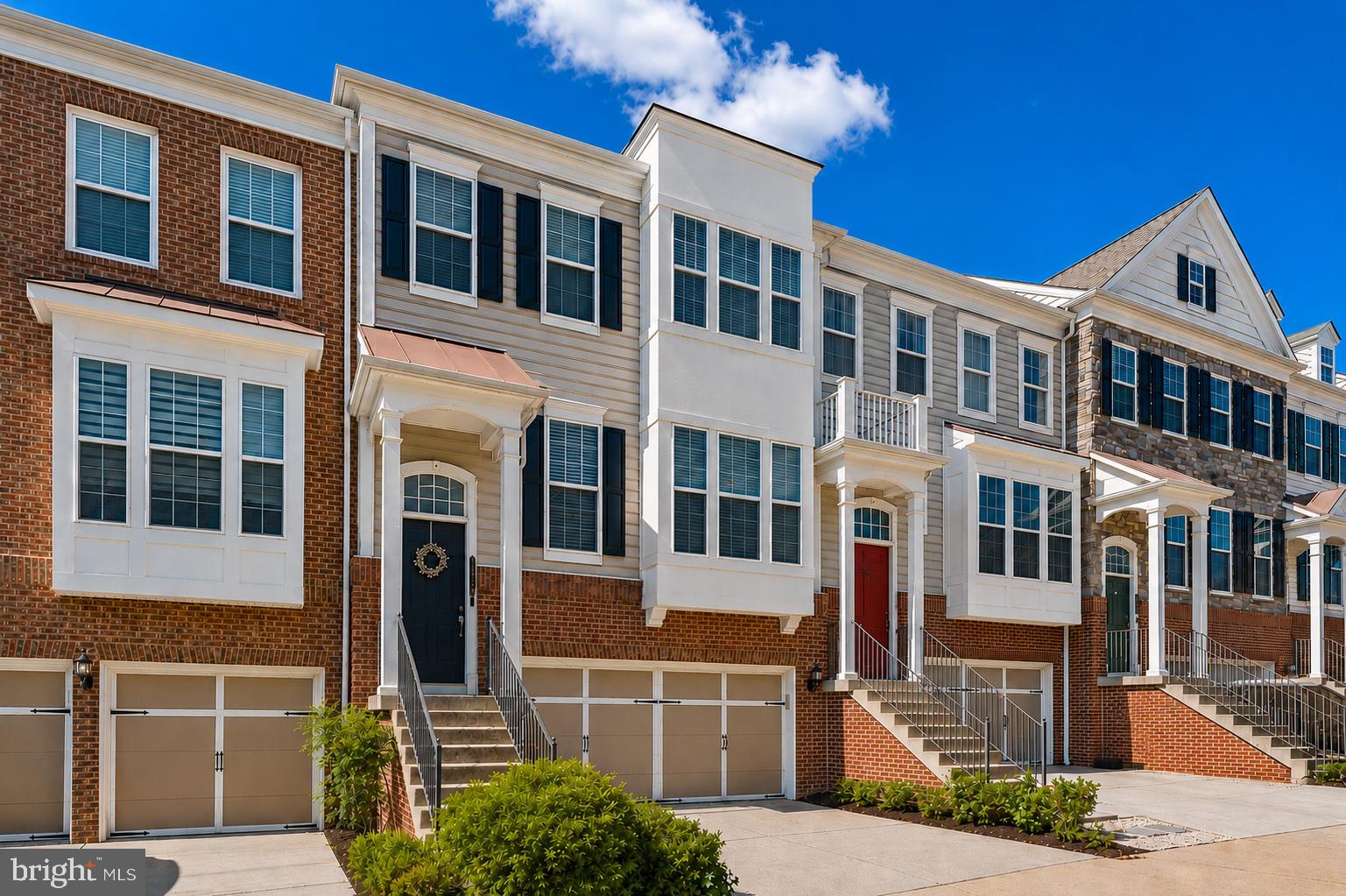 This exquisite luxury 2-car garage townhouse offers over 3,100 square feet of beautifully appointed living space in one of East Gate’s most desirable locations. The main level features gleaming hardwood floors, an elegant open floor plan, and a gourmet kitchen with granite countertops, upgraded cabinetry, and ample space for entertaining.
Step outside to the expansive composite deck and enjoy one of the home’s most exceptional features—a premium lot backing to beautifully maintained common area with no homes directly behind, providing a rare sense of privacy and peaceful outdoor living.
The spacious primary suite serves as a true retreat, featuring a large walk-in closet and a luxurious en-suite bath. The finished walkout lower level offers exceptional flexibility with a fourth bedroom, full bath, and a generous recreation room, perfect for guests, a home office, or additional living space.
Residents of East Gate enjoy an outstanding array of community amenities, including a clubhouse, swimming pool, playgrounds, walking trails, recreation fields, and abundant guest parking. The home is conveniently located within walking distance of East Gate Park & Ride, Harris Teeter, Walgreens, Wells Fargo, restaurants, and other everyday conveniences. Commuters will appreciate quick access to Route 50, Route 28, Route 66, Dulles International Airport, Chantilly Crossing, and Dulles Landing.
 a premium lot with open views, extensive living space, quality upgrades, and an exceptional location, this move-in ready home offers the perfect blend of luxury, privacy, and modern convenience.