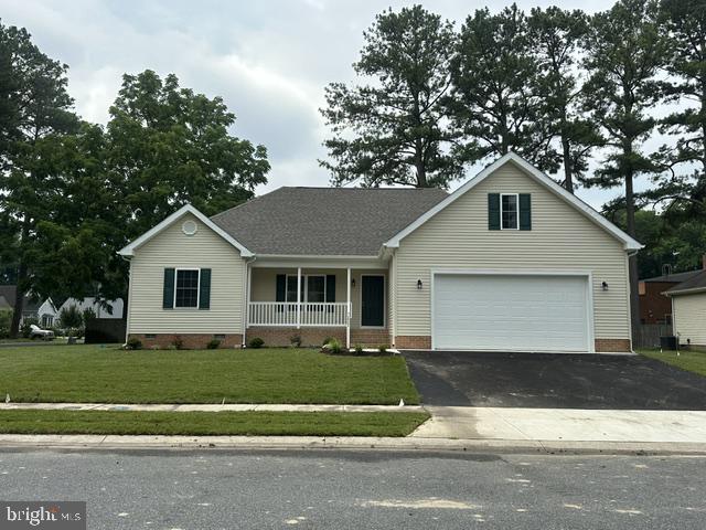 Open layout features kitchen with island. Dining area with sliding door to rear deck. Private primary bedroom with walkin closet and full bath. Home located in a completely maintained community. 2 car garage. Corner lot.