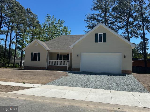 Open layout features kitchen with island. Dining area with sliding door to rear deck. Private primary bedroom with walkin closet and full bath. Home located in a completely maintained community. 2 car garage. Corner lot.