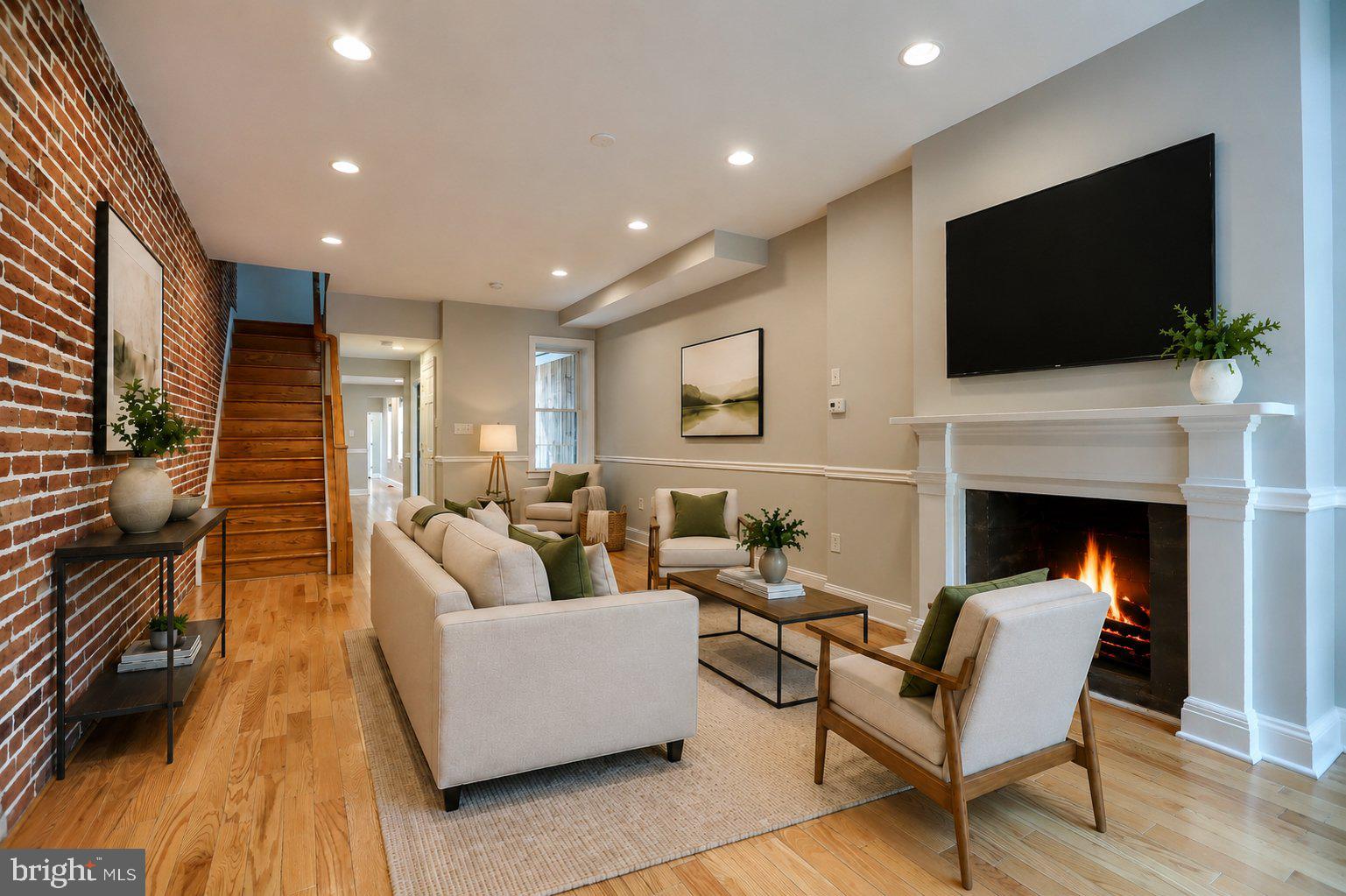 A first rate quality renovation took place in this townhome in 2012. A quality updating took place in this townhome in 2026.  The owners have taken great measures to refresh  this house This is a spacious 3 level townhome that includes a basement good for storage. The house contains beautiful real Oak floors , exposed original brick walls on all 3 living levels and  several rooms with high ceilings.  The block is situated  very close to the Johns Hopkins Medical Campus.  Close enough to walk. If you don't want to walk take the Hopkins Shuttle. The Upper Fells Point  neighborhood borders the Fells Point Historic District as well as Butchers Hill and Patterson Park. Other nearby communities include Canton, Harbor East as well as Harbor Point. Come see what a quality townhouse looks like.