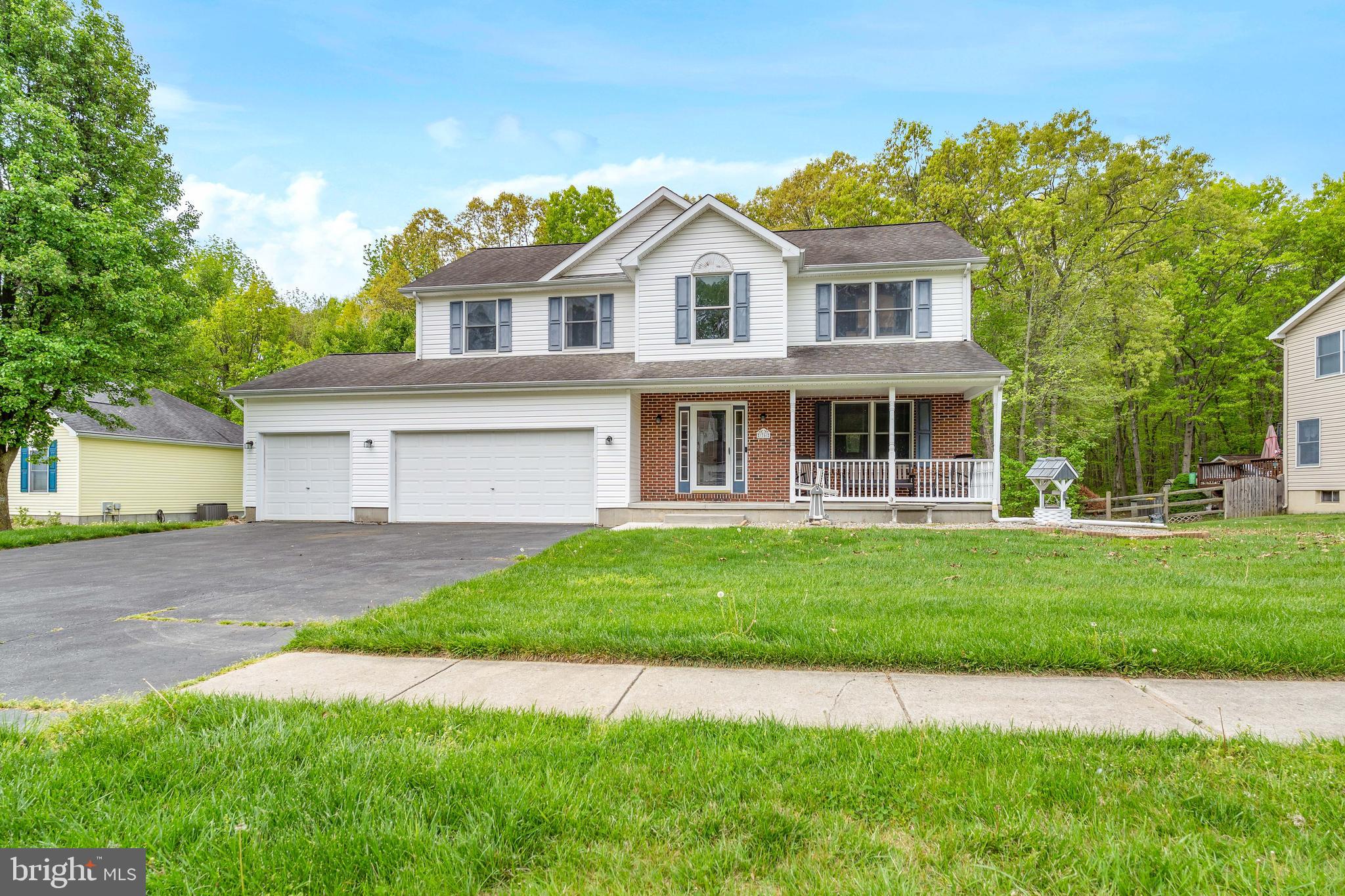 Beautifully maintained home in the sought-after Whitaker Woods community in North East, MD, offering over 2,800 finished square feet on a spacious .78-acre lot. This attractive home features a brick front with vinyl siding and architectural shingles, along with a huge covered front porch—perfect for relaxing—and a rear deck off the family room for outdoor entertaining.

Inside, the main level offers a welcoming foyer, living room, and dining room, all accented with hardwood floors and 9-foot ceilings. The spacious kitchen is equipped with 42” wall cabinets, stainless steel appliances, a pantry, and a breakfast area, with convenient access to the main-level laundry room. The family room is a standout, featuring a gas fireplace and cathedral ceilings, creating a bright and open gathering space.

Upstairs, the home boasts a huge primary suite complete with a private sitting room, walk-in closet, and an en-suite bath featuring a walk-in shower and separate soaking tub. Three additional generously sized bedrooms and a full bathroom complete the upper level.

The basement offers a finished hobby room with sink, along with a large unfinished area providing extensive storage, a walk-out double door, and rough-in plumbing for a future bathroom, offering excellent potential for additional living space.

A rare find, this home also includes a 3-car attached garage, providing ample space for vehicles, storage, or a workshop. 2022 HV/AC Replaced  

This home offers space, functionality, and desirable features in a prime location—don’t miss the opportunity to make it yours!