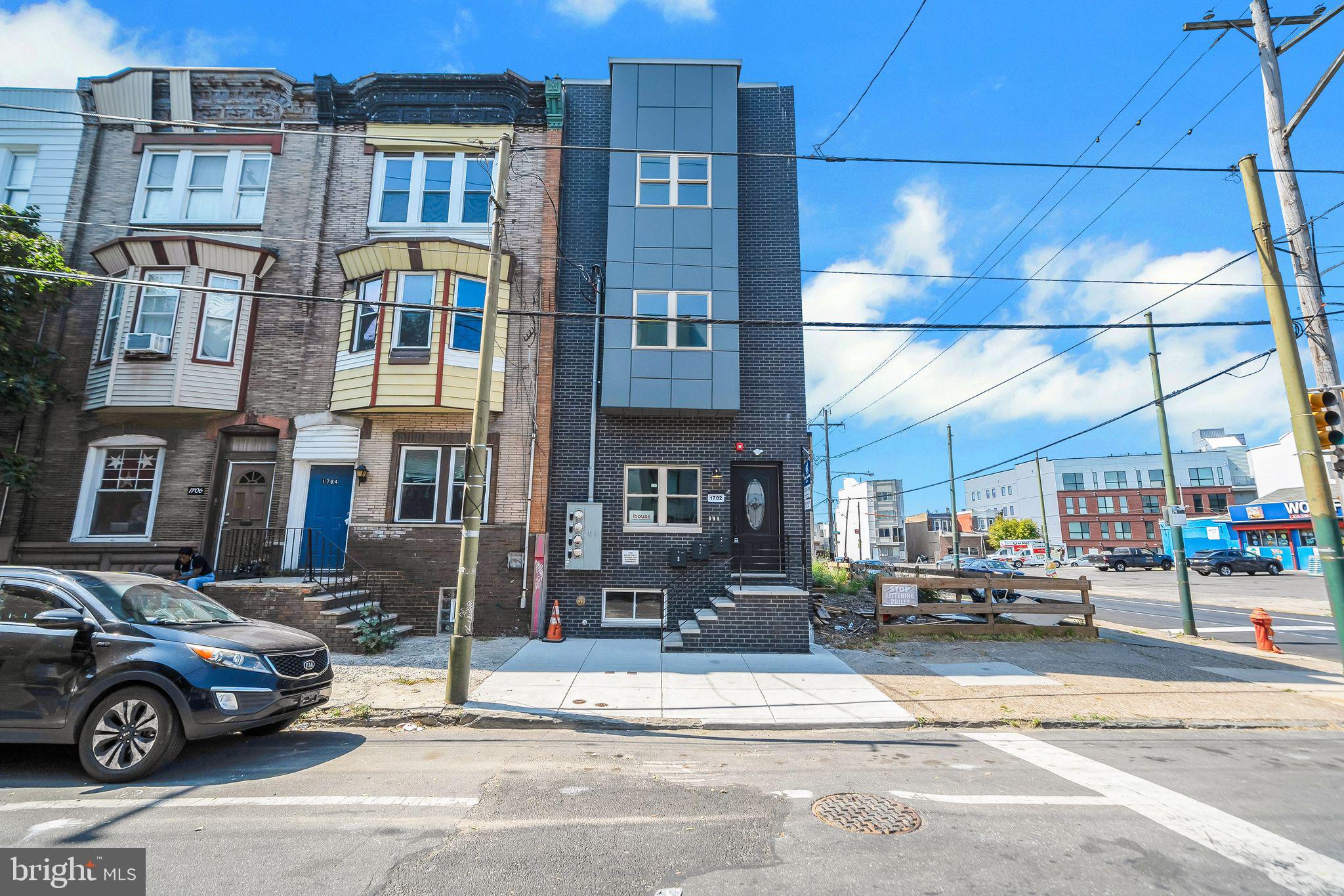 This brand-new construction triplex in the heart of Point Breeze offers an exceptional investment opportunity with a many -years (estimate 9) left on the  tax abatement and three beautifully designed units featuring modern finishes, hardwood flooring, and abundant natural light throughout. Unit One currently rented, presents an open-concept living and kitchen area with stainless steel appliances, white cabinets, quartz countertops, and a backsplash, along with two first-floor bedrooms, a rear bedroom that opens to a spacious yard ideal for entertaining, a lower-level bedroom or flex space for an office or gym, an additional living area, and two full bathrooms. Unit Two features two spacious bedrooms, two full bathrooms including a master en suite, a stylish kitchen with stainless steel appliances and quartz finishes, stackable washer/dryer, and additional breezeway windows for enhanced sunlight. Unit Three includes two bedrooms with a master en suite, a modern kitchen matching the other units, stackable washer/dryer, and a private rooftop deck with impressive views. All units include microwaves, refrigerators, and electric stoves. Located just blocks from the Broad Street Line and close to Center City, the sports district, restaurants, major highways, and bridges, this property offers convenience and accessibility. Ideal for investors seeking rental income, owner-occupants looking to live in one unit while renting the others, or multi-generational living, this versatile triplex provides both modern comfort and strong long-term value in a vibrant neighborhood. pictures taken prior to tenant moving into unit 1.