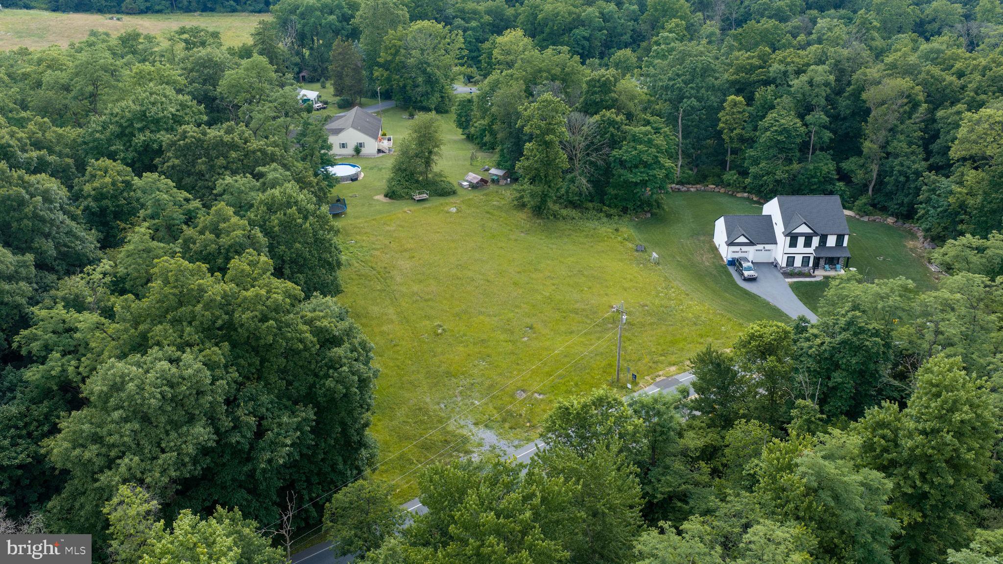 Create the home you've always envisioned with Beiler Home Builders, the exclusive builder for this nearly half-acre homesite with easy access to downtown Elizabethtown and Route 283. Looking for additional options? Lot No. 4 is also available for purchase alongside Lot No 5. Build from your own plans or explore a variety of custom plans through Beiler Home Builders. The sample Beiler home shown in this listing is a 3,000 square foot residence featuring four second-floor bedrooms and three full baths, including a vaulted-ceiling primary suite with a spacious walk-in closet and private bath with soaking tub, shower, and dual sinks. Two additional bedrooms share a nearby full bath, while the fourth bedroom includes its own attached full bath. The main floor offers an open family room, breakfast area, and kitchen with access to the rear patio. Also on the main level are a study, formal dining room, and powder room. A two-story foyer welcomes you at the entrance. Just off the two-car garage are a mudroom and separate laundry room. Built with Superior Walls, the basement is ready to be finished for additional living space or used for storage. Call us today to start plans for your dream home!