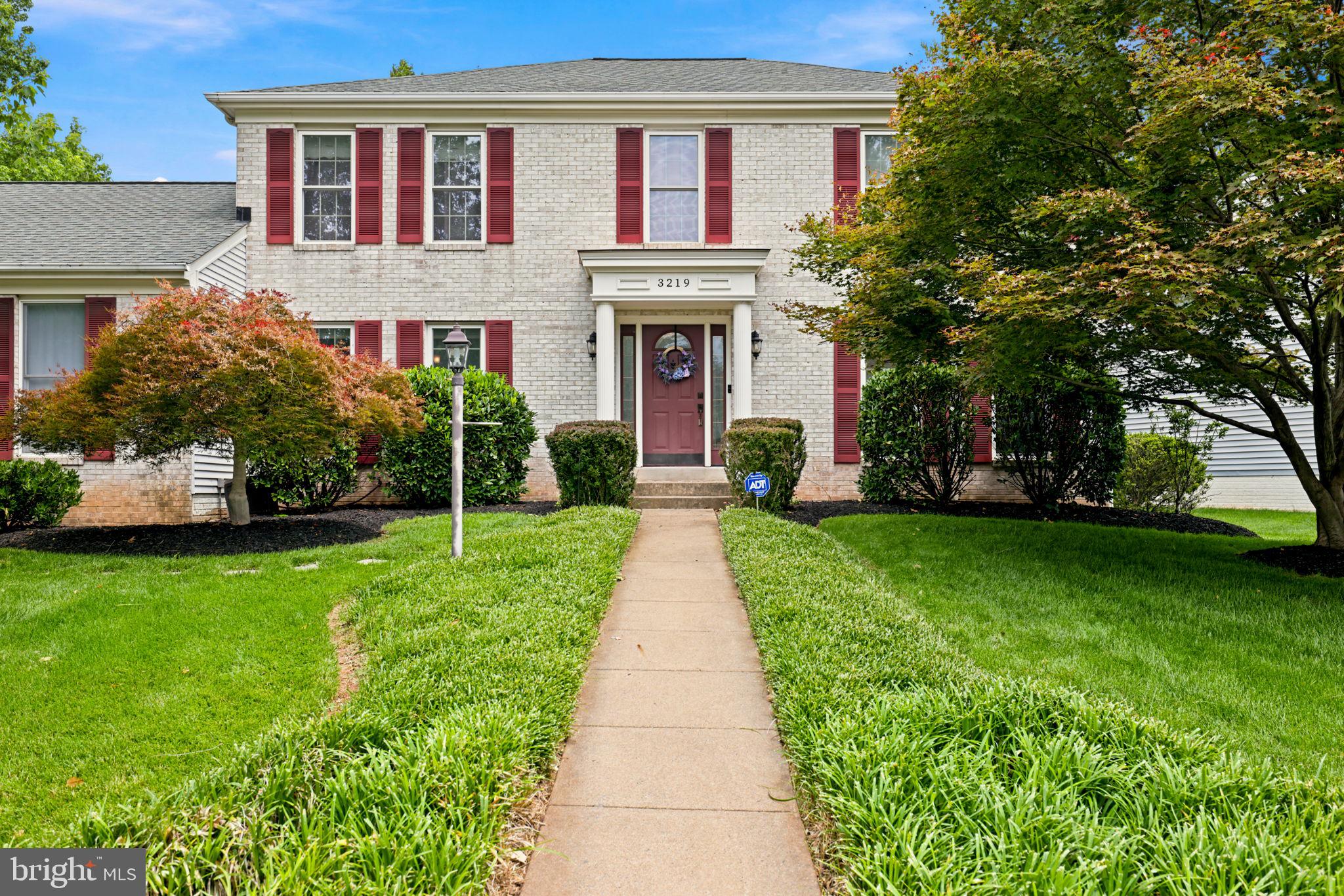 Welcome to 3219 Grassmere Court, a brick-front colonial ideally situated on a landscaped cul-de-sac lot in Oak Hill. Surrounded by mature trees, this home offers spacious living across three finished levels. The main level features hardwood floors, a spacious kitchen with granite countertops, abundant cabinetry, and a breakfast nook that opens to the family room with fireplace and custom built-ins. Upstairs, the expansive primary suite includes a walk-in closet and a well-appointed en-suite bath with a large walk-in shower. The finished lower level is designed for entertaining, featuring a custom wet bar, recreation area, and two bonus rooms ideal for a home office, gym, hobby room, or additional flex space. Enjoy outdoor living on the screened porch, patio and deck overlooking the fenced backyard. Located in the Franklin Farm community and convenient to shopping, dining, parks, major commuter routes, and in the Oakton High School pyramid, this home offers generous living space in a prime Oak Hill location.