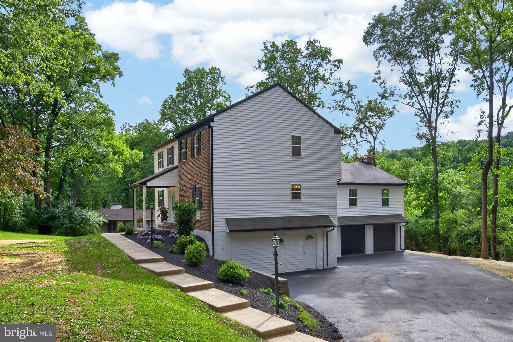 Discover refined living in this beautifully upgraded over 3,000 sq.ft 4 bedroom, 3.5 bathrooms residence located within Downingtown Area School District and highly renowned STEM Academy. This home offers a rare level of versatility with two primary suites, including a luxurious first floor option ideal for multigenerational living or an elevated guest experience with its beautifully tiled large bathroom with an open shower concept design, and dedicated walk-in closet. The spacious, multifaceted theme of the home carries to the oversized multi-car garage, which can easily accommodate up-to six cars, including full-size trucks, or large equipment.
The main level showcases sophisticated design and exceptional craftsmanship. A dedicated office/study with a stately fireplace sets the tone, leading into a stunning open concept gourmet kitchen with a large island and premium finishes. The kitchen flows effortlessly into the expansive living room, where a second fireplace and access to a private deck create an elegant yet comfortable atmosphere. Abundant natural light and new hardwood floors throughout the home enhance the sense of openness and style.
Upstairs, the second primary suite offers a serene retreat with a sitting area, a spacious bathroom with ample natural light highlighting the beautifully crafted features, and a large walk in closet. The rest of the second floor living space is complemented by two additional bedrooms and a nicely appointed hallway bath featuring a soaking tub. 
This turn key home has undergone extensive improvements, including new roof, new windows, new siding, new hardwood flooring, a new furnace, and a new water heater — ensuring both beauty and performance. Perfectly positioned near scenic parks and walking trails, including the Struble Trail, the home also provides quick access to Downingtown Borough, Exton shops and restaurants, and Marsh Creek State Park. Major roads and highways (Rt. 202, Rt. 322, Rt. 30 Business and Bypass, Rt. 100, Rt. 113, and the PA Turnpike) are moments away, offering seamless connectivity.
A rare blend of luxury, comfort, and location — this home is ready to impress.